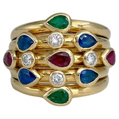 Vintage 1990s Adler “Serail” 18 Karat Gold Ruby Sapphire Emerald Diamond Five Band Ring