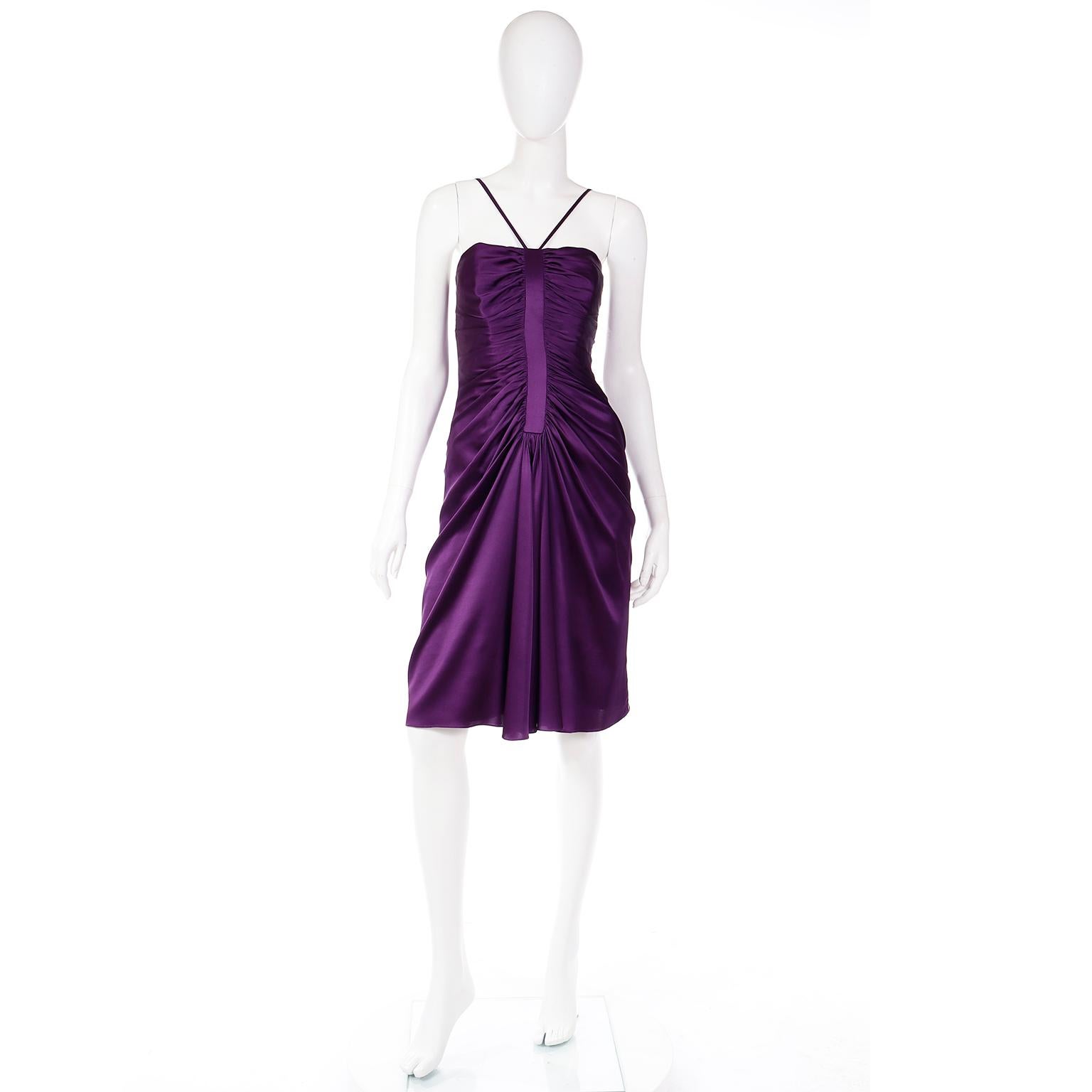 This is a beautiful vintage late 1990's or early 2000's Adolfo Dominguez purple silk charmeuse evening dress with lovely gathering and drape at the front and spaghetti straps. 
This gorgeous, fully lined evening dress has a built in corset with