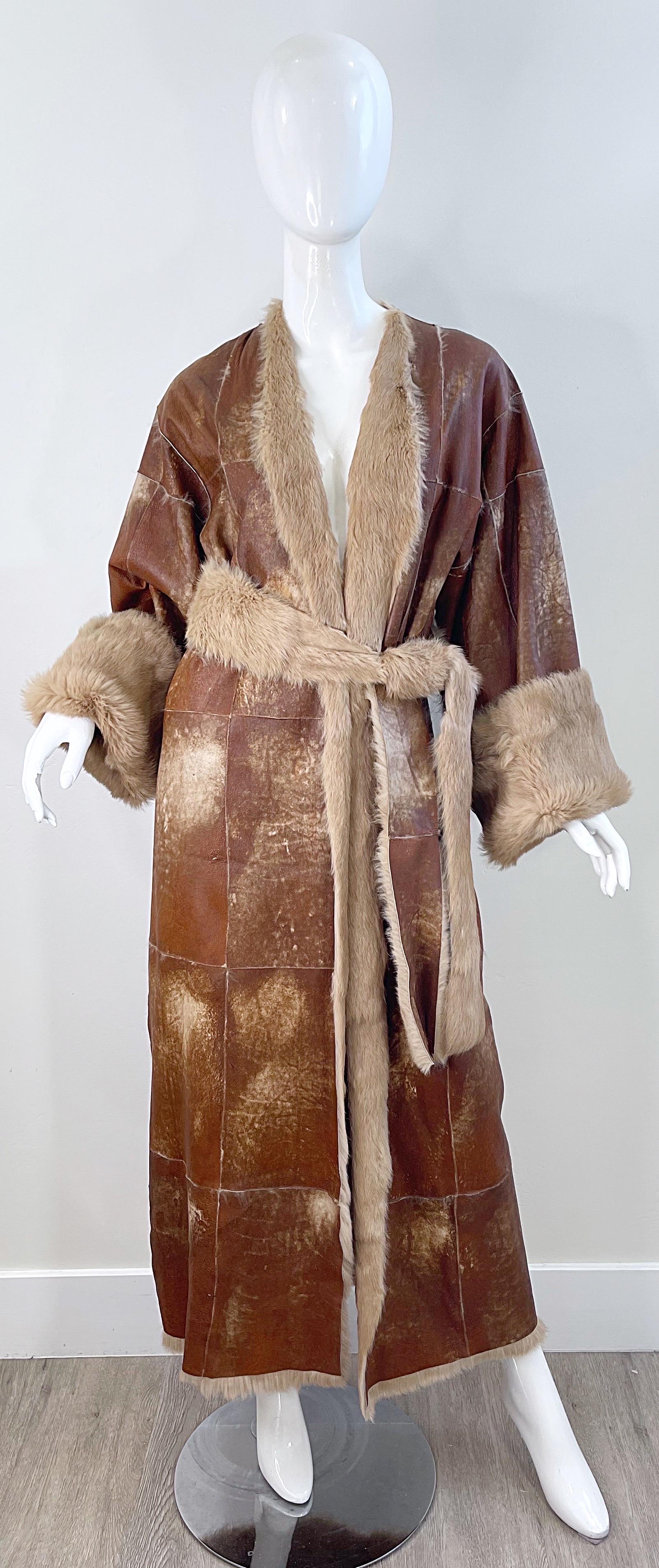 Chic late 90s ADRIENNE LANDAU brown distressed leather and rabbit fur coat ! The softest most plush fur fully lines this rare beauty. The perfect neutral jacket for all winter. Matching belt is reversible. 
In great unworn condition 
Made in