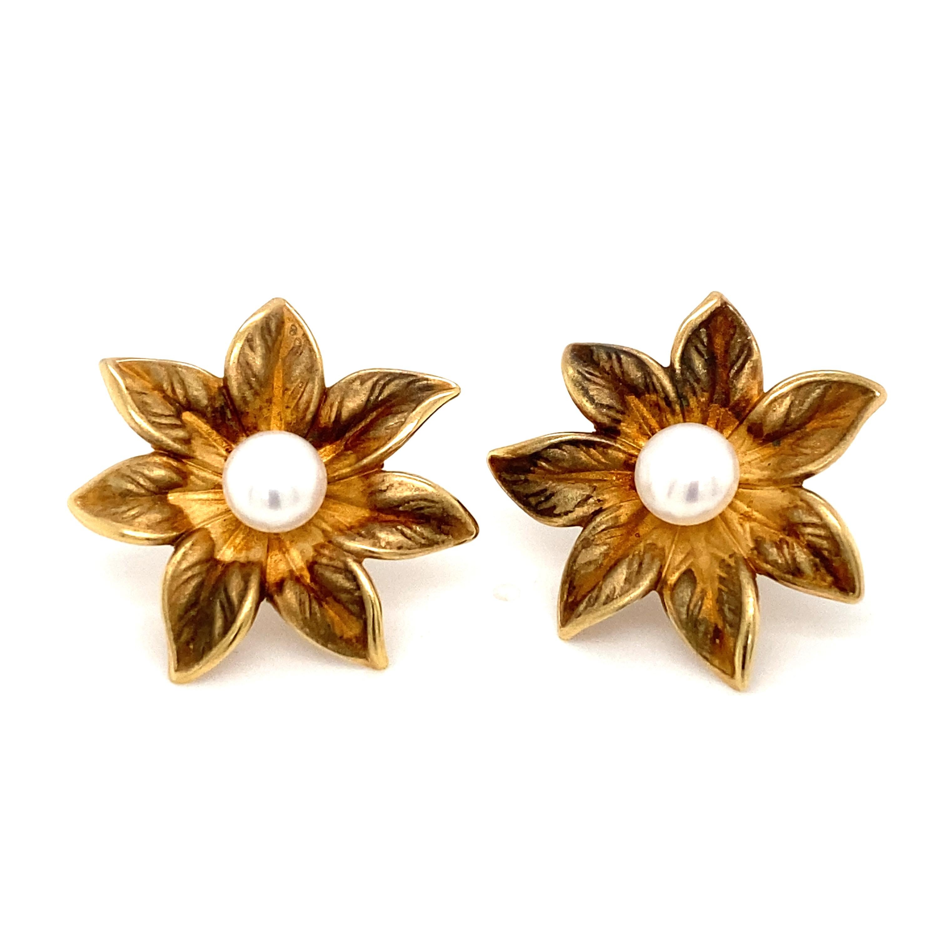 Item Details: These vintage earrings have Akoya Pearls in the centers with a brushed gold design on the flower petals. The earrings are crafted in 14 karat yellow gold. The high contrast of yellow gold sits beautifully with a pop of pearl in the