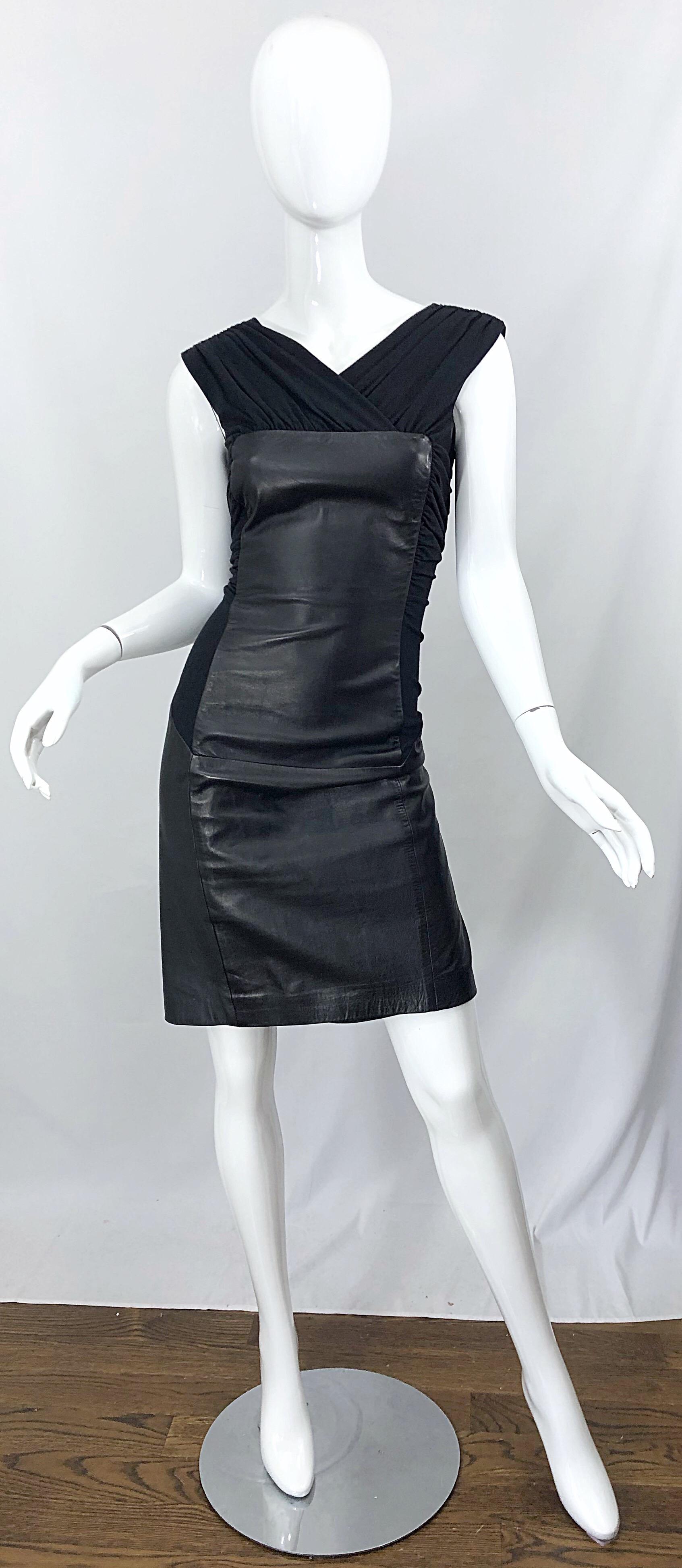 Avant Garde mid 90s ALBERTA FERRETTI black leather and jersey dress! While mostly cut of soft black leather, double faced jersey is placed in all the right places. Panels at each side of the body give the ability of stretch. Hidden zipper up the