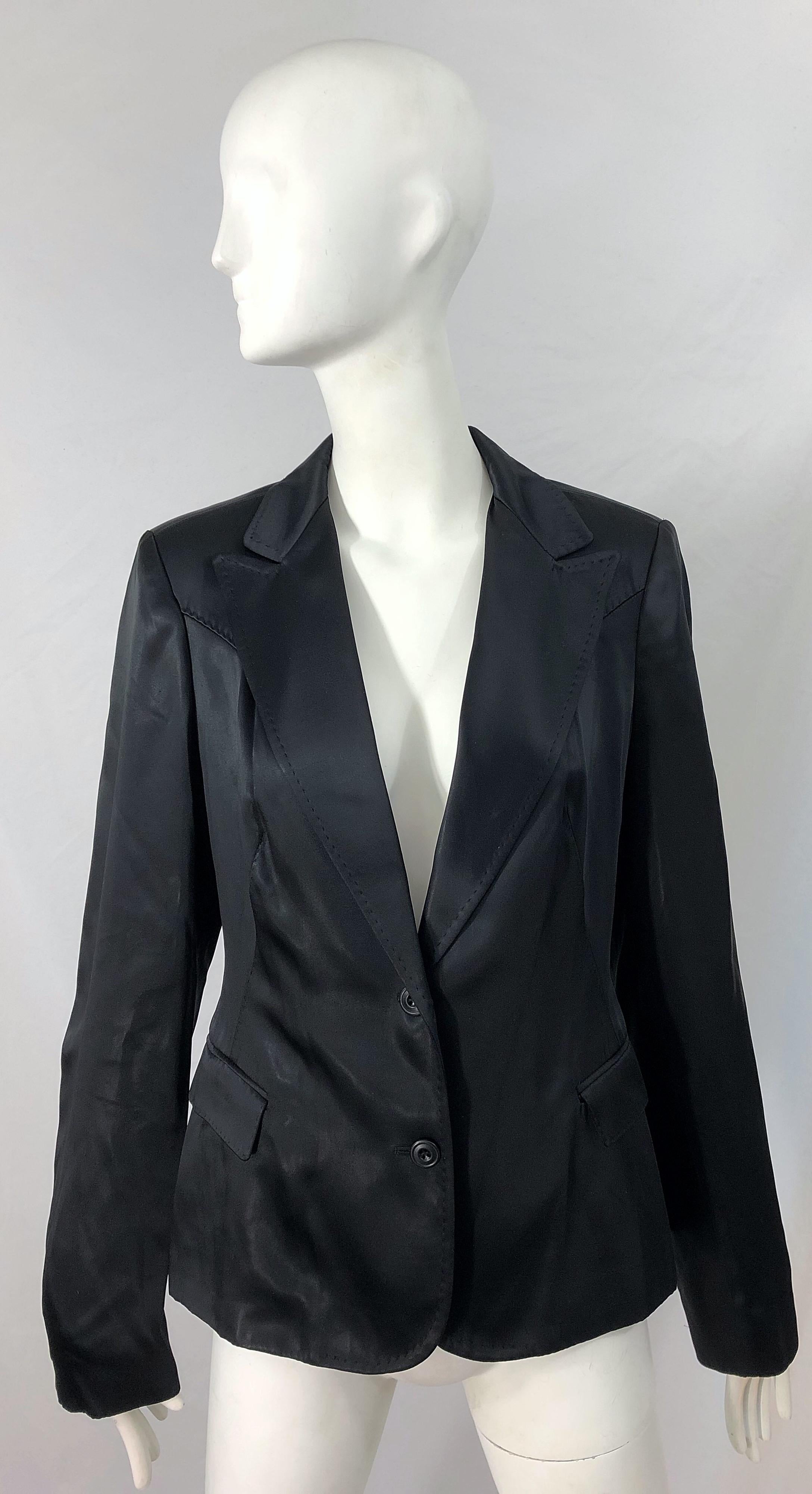 Chic late 90s ALESSANDRO DELL'ACQUA black silk satin look blazer jacket ! Smart tailored fit, with two buttons up the front. Pockets at each side of the waist. Fully lined. The perfect black blazer that is a timeless investment to any wardrobe.