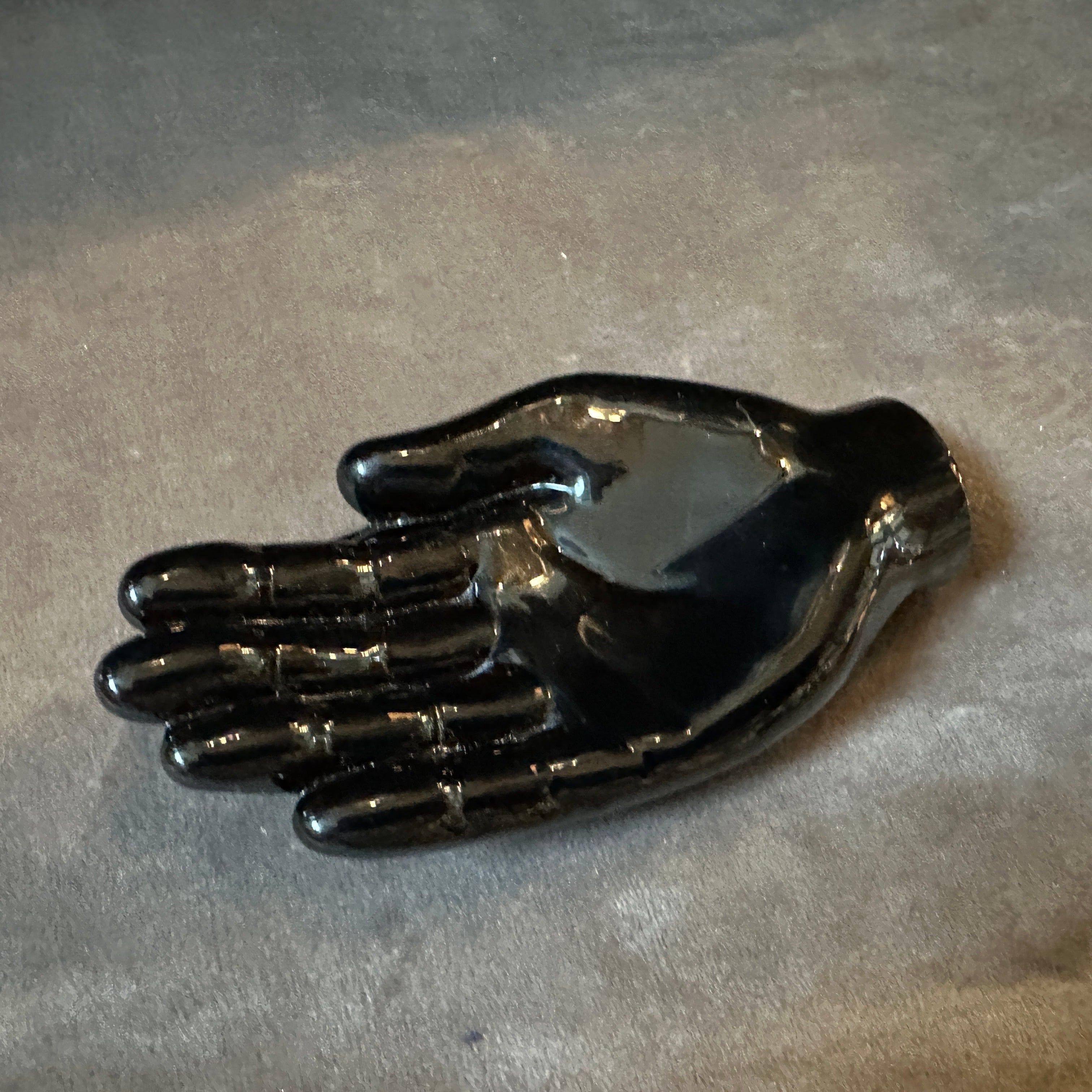 This paperweight reflects the elegance and modern artistry of 1990s Murano glass while also carrying the signature style of one of the most renowned Venetian glassmakers of the 20th century. The paperweight is made from black Murano glass, which is