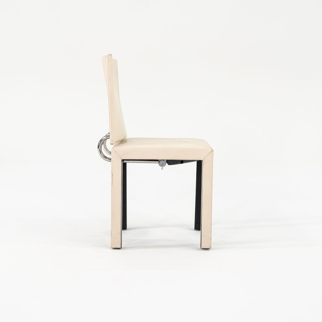 This is an ‚ÄòArcadia‚Äô armless dining chair, initially designed by Paolo Piva for B & B Italia in 1989. This piece was produced in Italy around the same time. It features a simplistic modern design with straight symmetrical lines, and has a fun