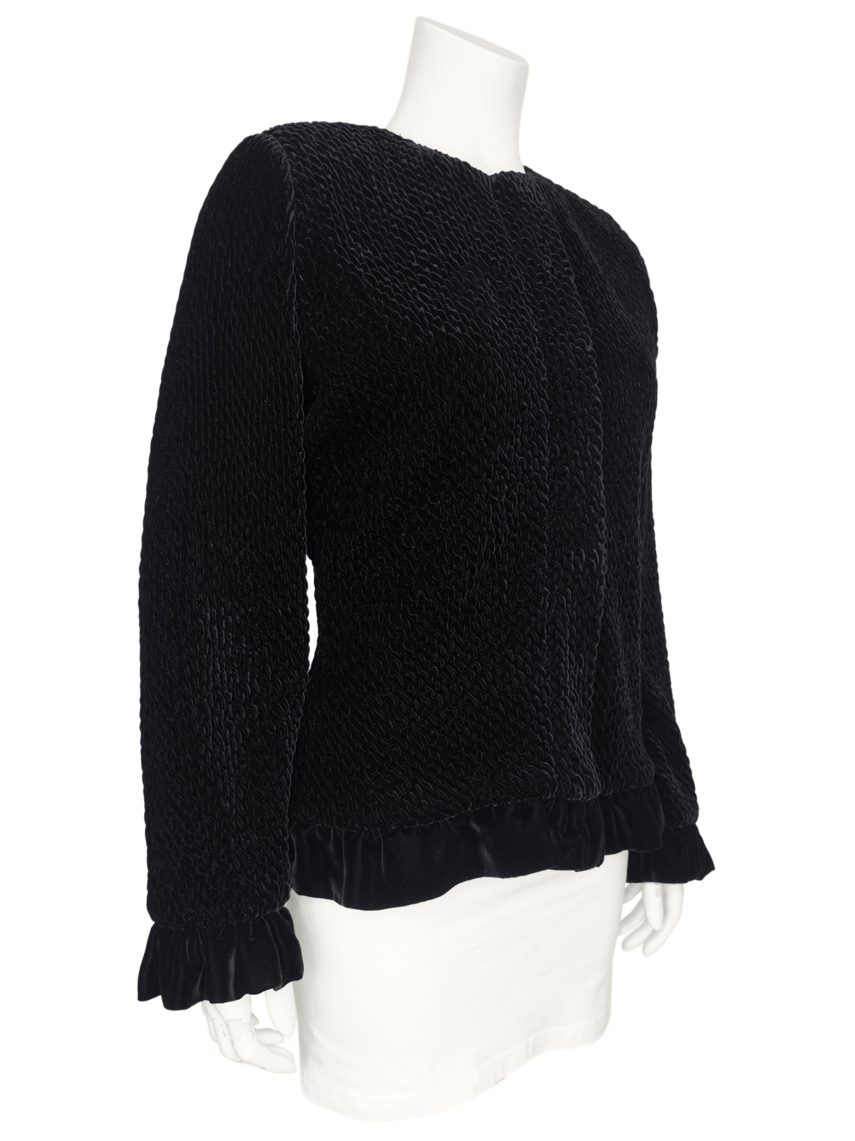 Beautiful Giorgio Armani early 1990s black velvet chenille evening jacket with zip up the front and snaps hidden behind a placket. The jacket has a unique sewing technique that mimics broadtail and creates a lovely texture. Finished with velvet