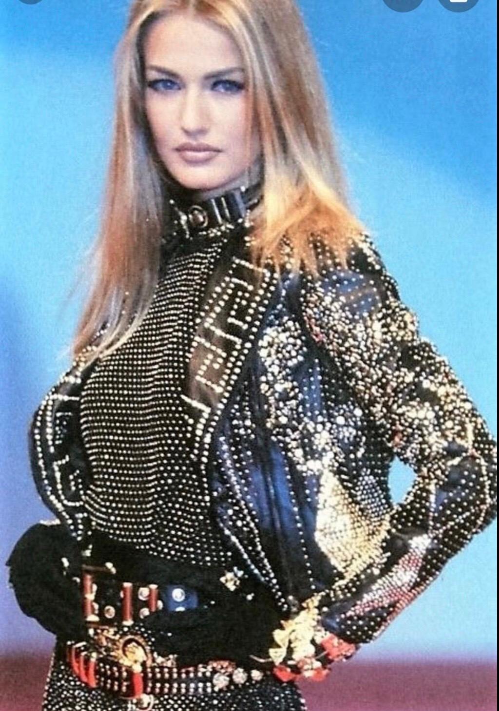 1990S ATELIER VERSACE Black Leather 1991 Cropped Biker Jacket Covered In Gold Studs & Crystals