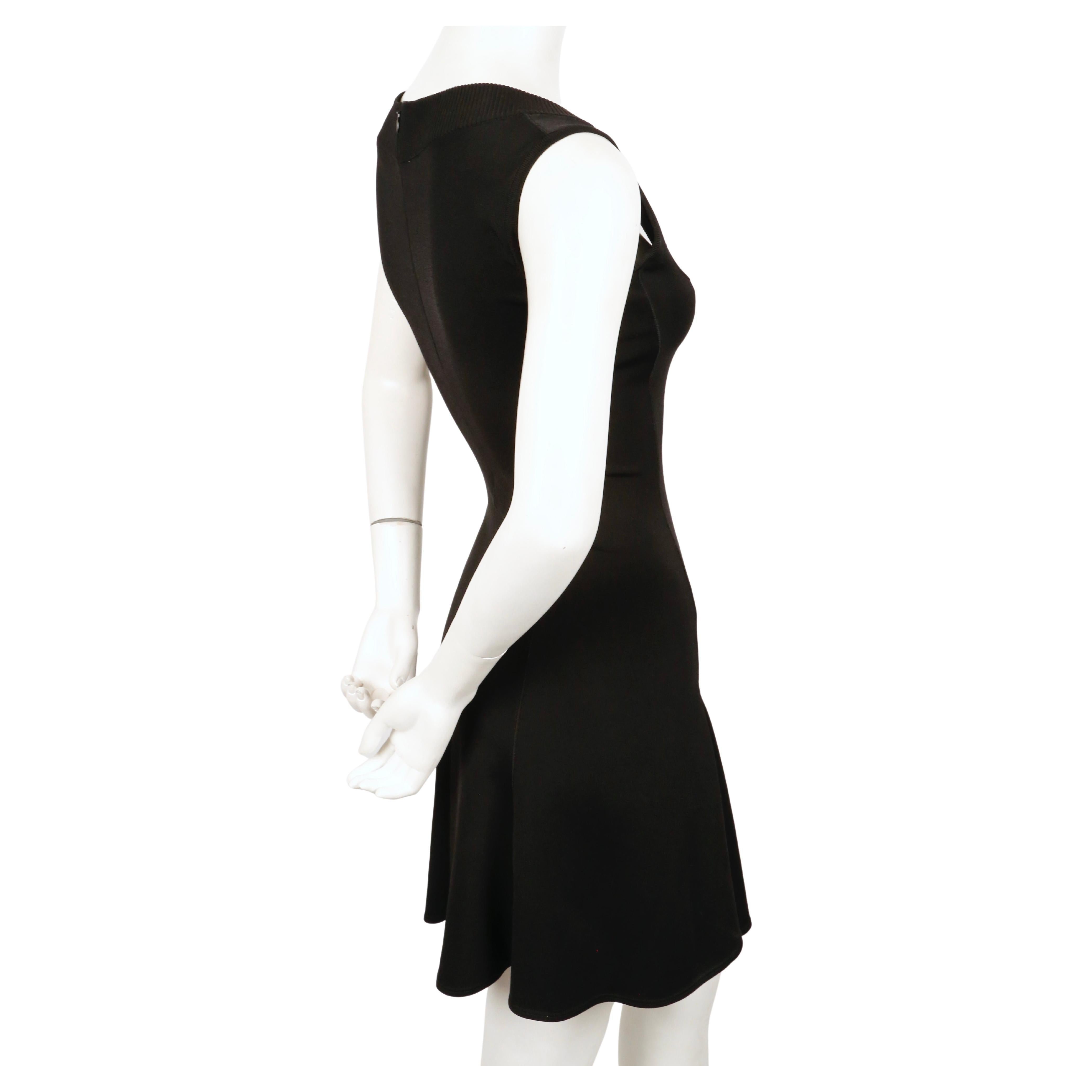 Jet-black, flared, sleeveless dress  designed by Azzedine Alaia dating to the early 1990's. No size label although this best fits an XS or  S. Approximate measurements (unstretched): bust 30
