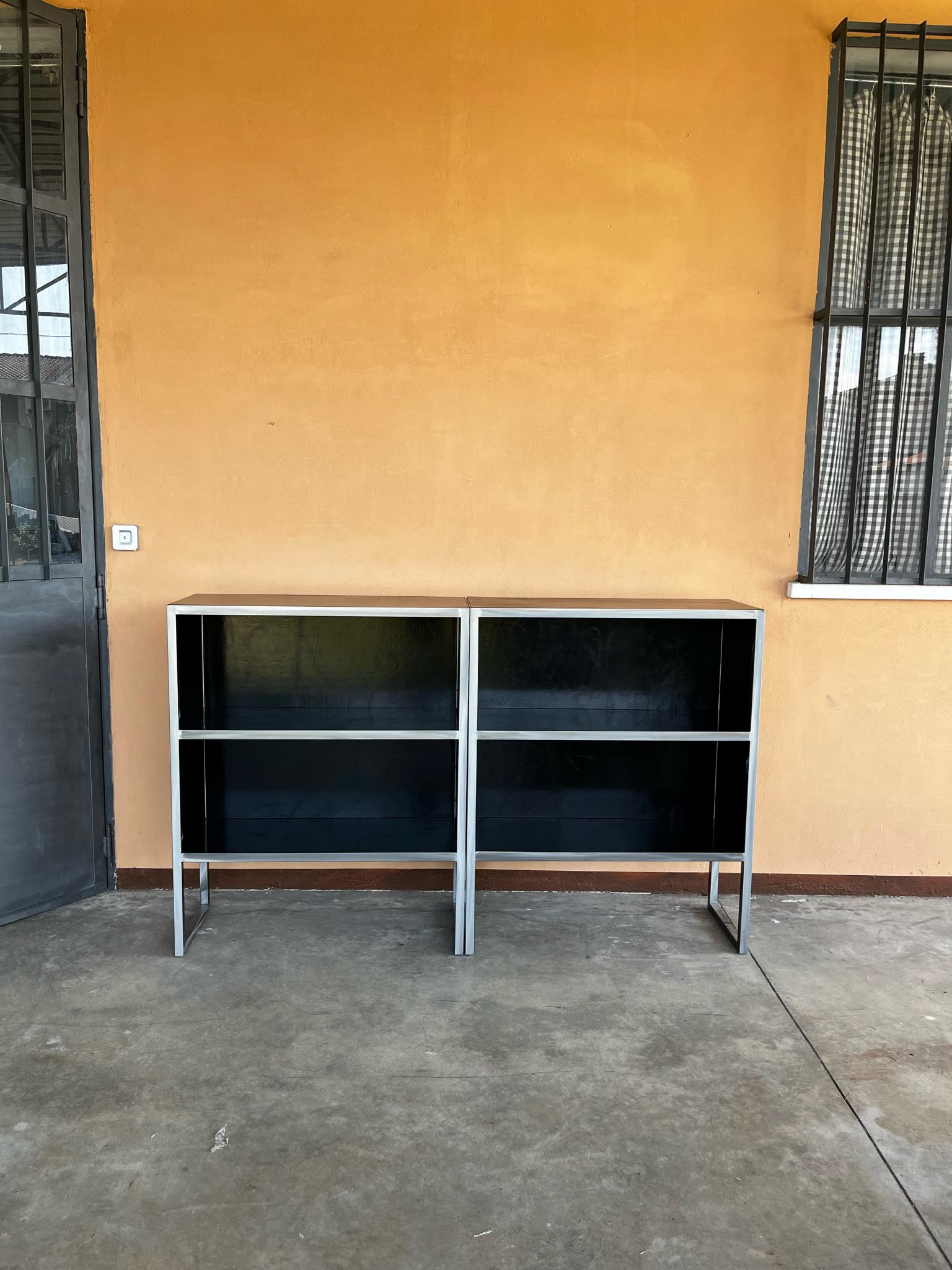 Black leather bookcases with steel structure by Baxter form Italy form 1990s period.
Excellent conditions. They were part of furniture of a prestigious law firm.
Size of each book case 100 x 42 H 123 cm.
A video is available upon request.
 
 