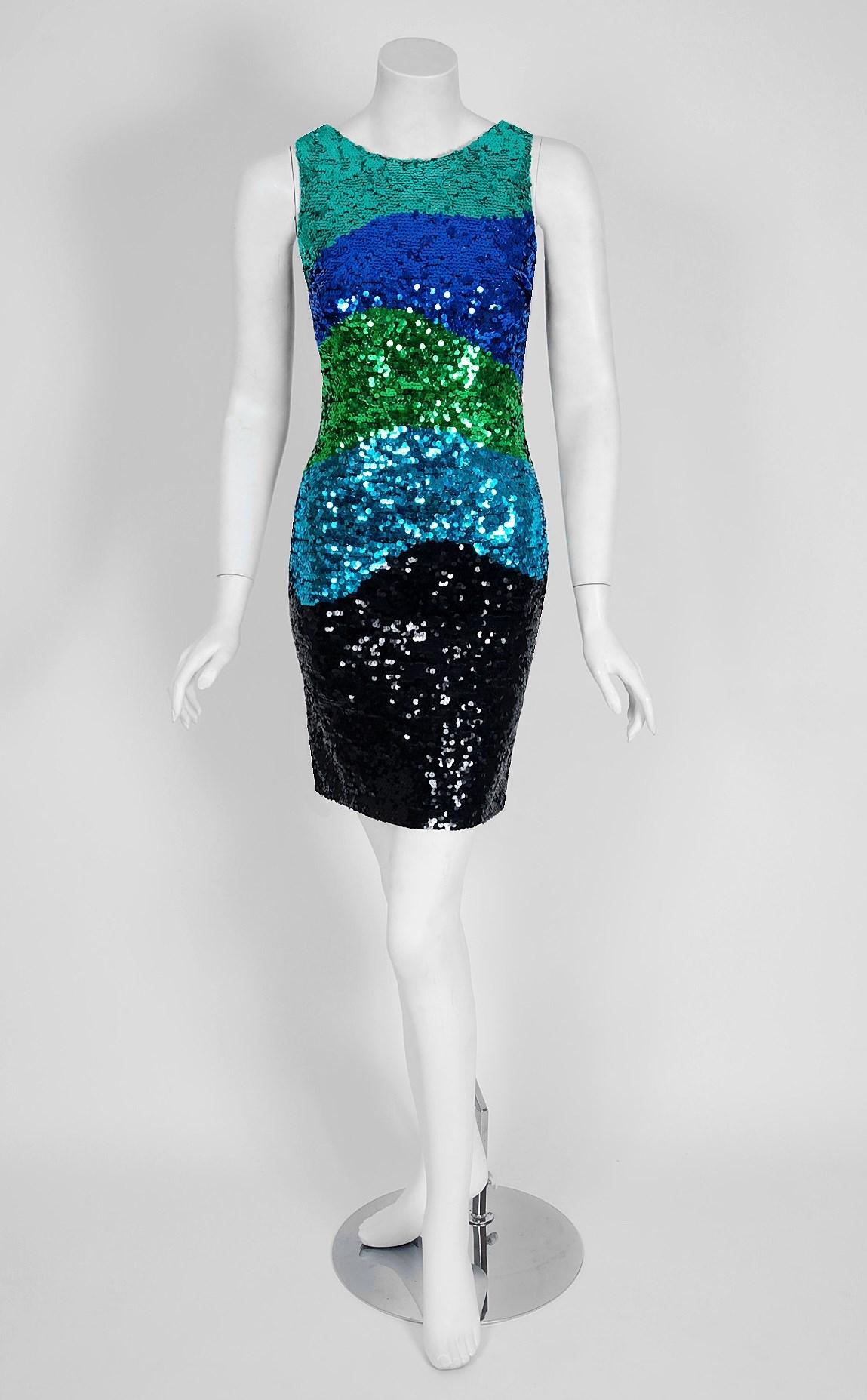 This seductive mid-1990's Bergdorf Goodman bodycon dress has a fantastic ombre gradient design worked in which is guaranteed to light up any room. The base is an ultra-soft stretch knit. I love the sleeveless low backside bodice. The narrowing