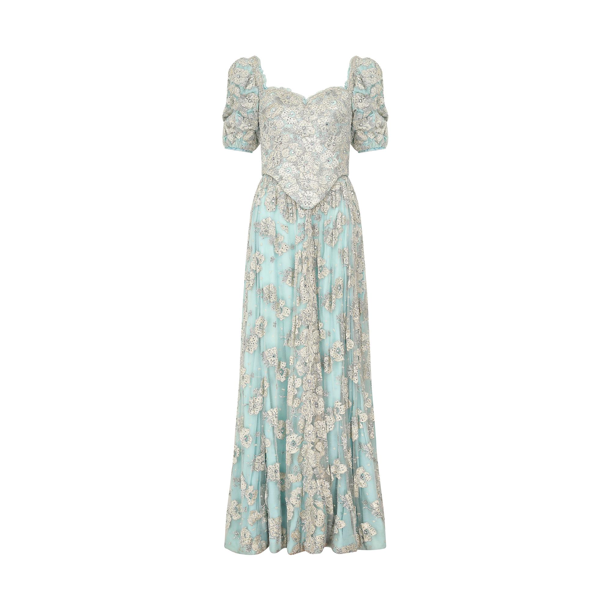 This magnificent 1990s bespoke made embellished lace and crystal dress is a fairytale dream.  The top section features a heavily crystal studded lace and turquoise bodice which has an incredible internal structure, made up of heavy boning, shaped