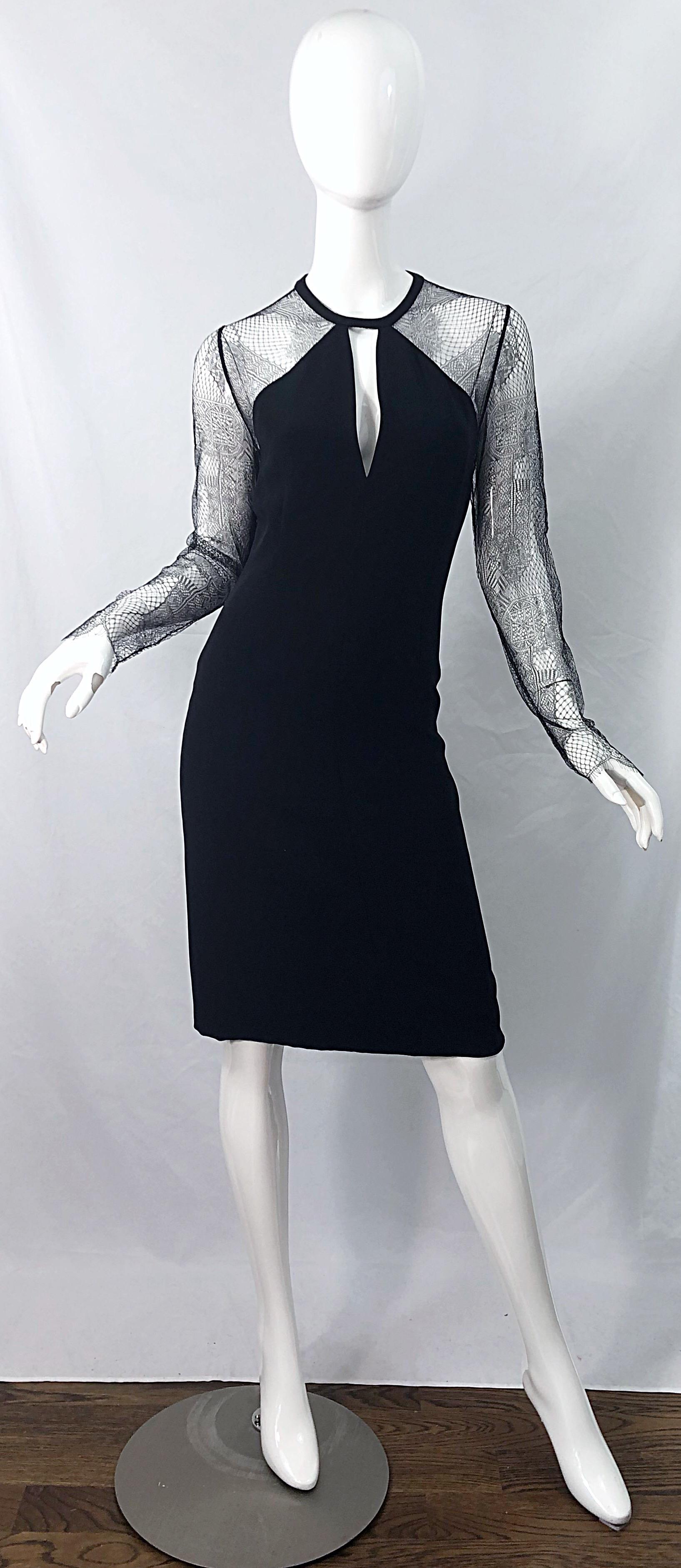 Beautiful and classic vintage early 1990s BILL BLASS black silk and lace cut-out dress ! This is not just your ordinary everyday black dress--this one is very special! Features sheer black lace sleeves and back.
Peek-a-boo cut-out at center neck.