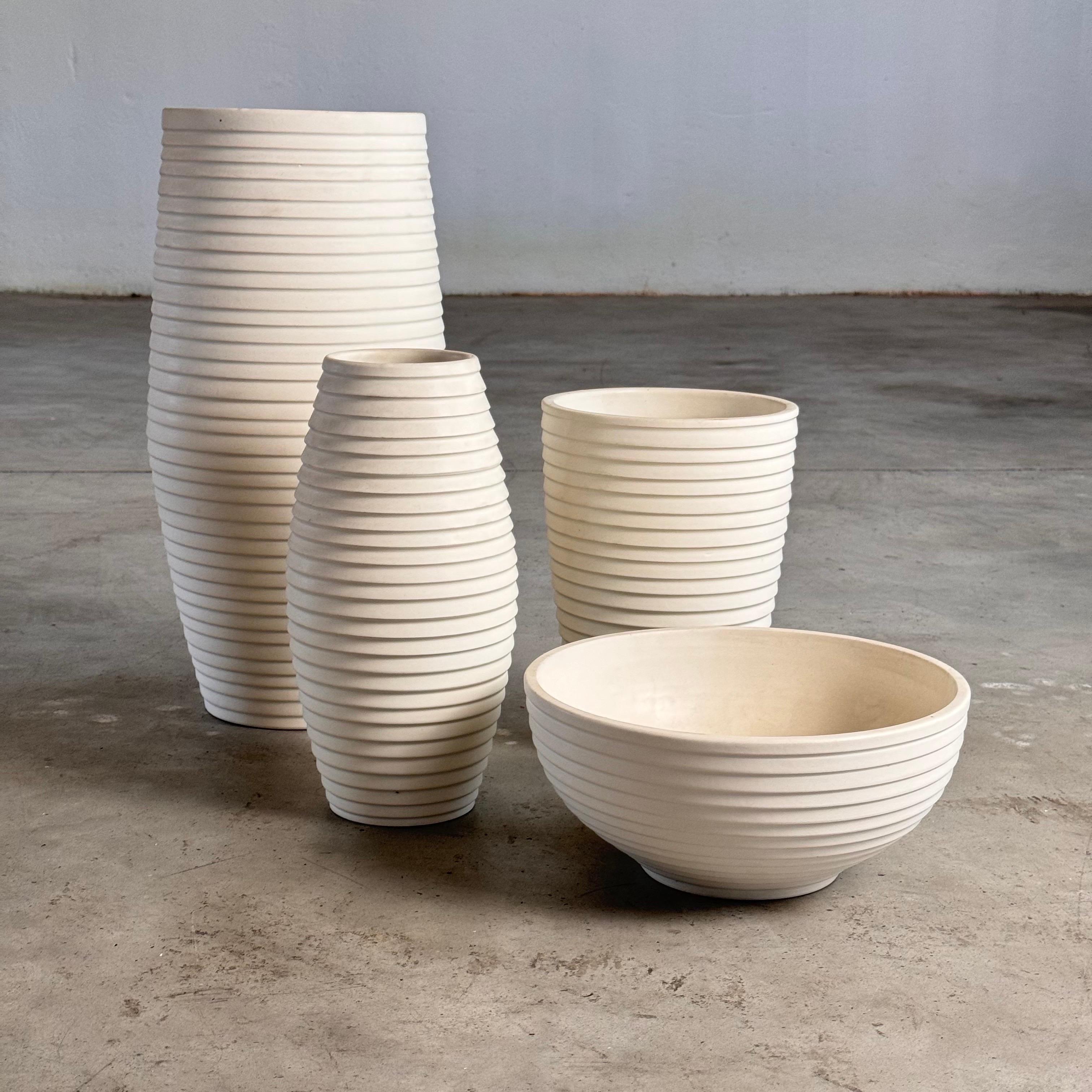 Renowned for their exceptional quality and timeless design, this exquisite 1990s Bitossi ceramic set features a stunning textured pattern of fine horizontal stripes worked around the circumference of each piece. Presented in immaculate condition,