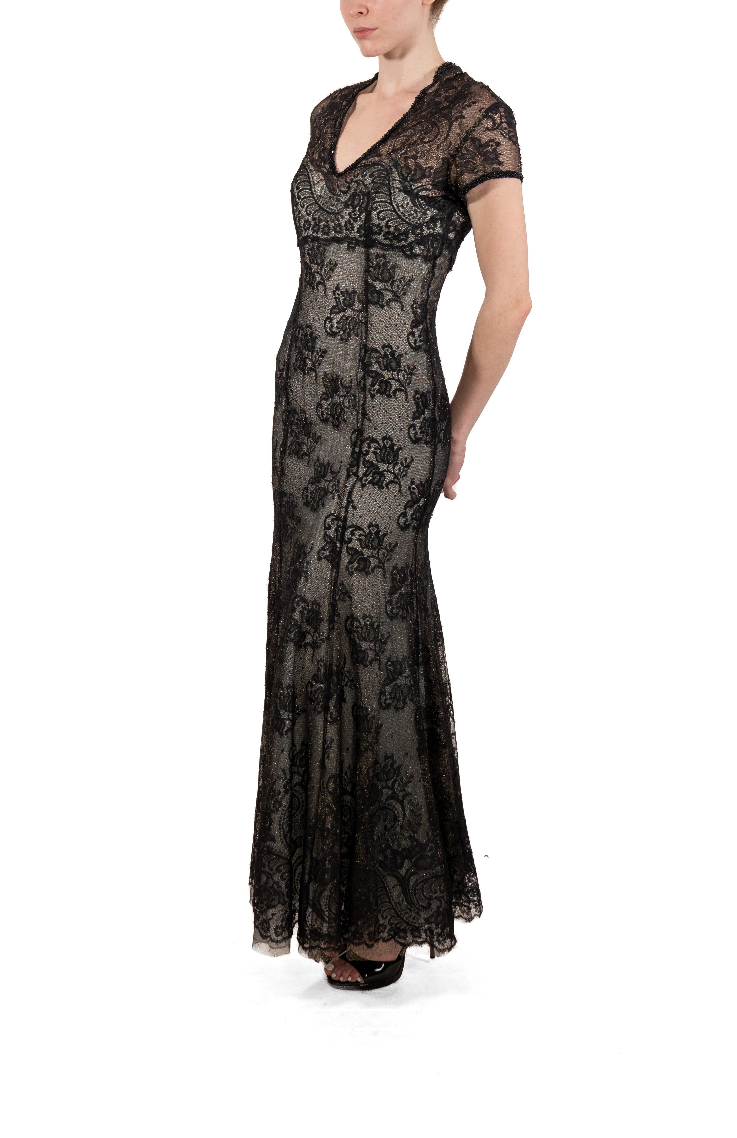 This gown retains no label, however the amount of hand-finishing points to Haute Couture or custom made quality, fully lined in silk. 1990S Black Chantilly Lace Short Sleeved Gown 