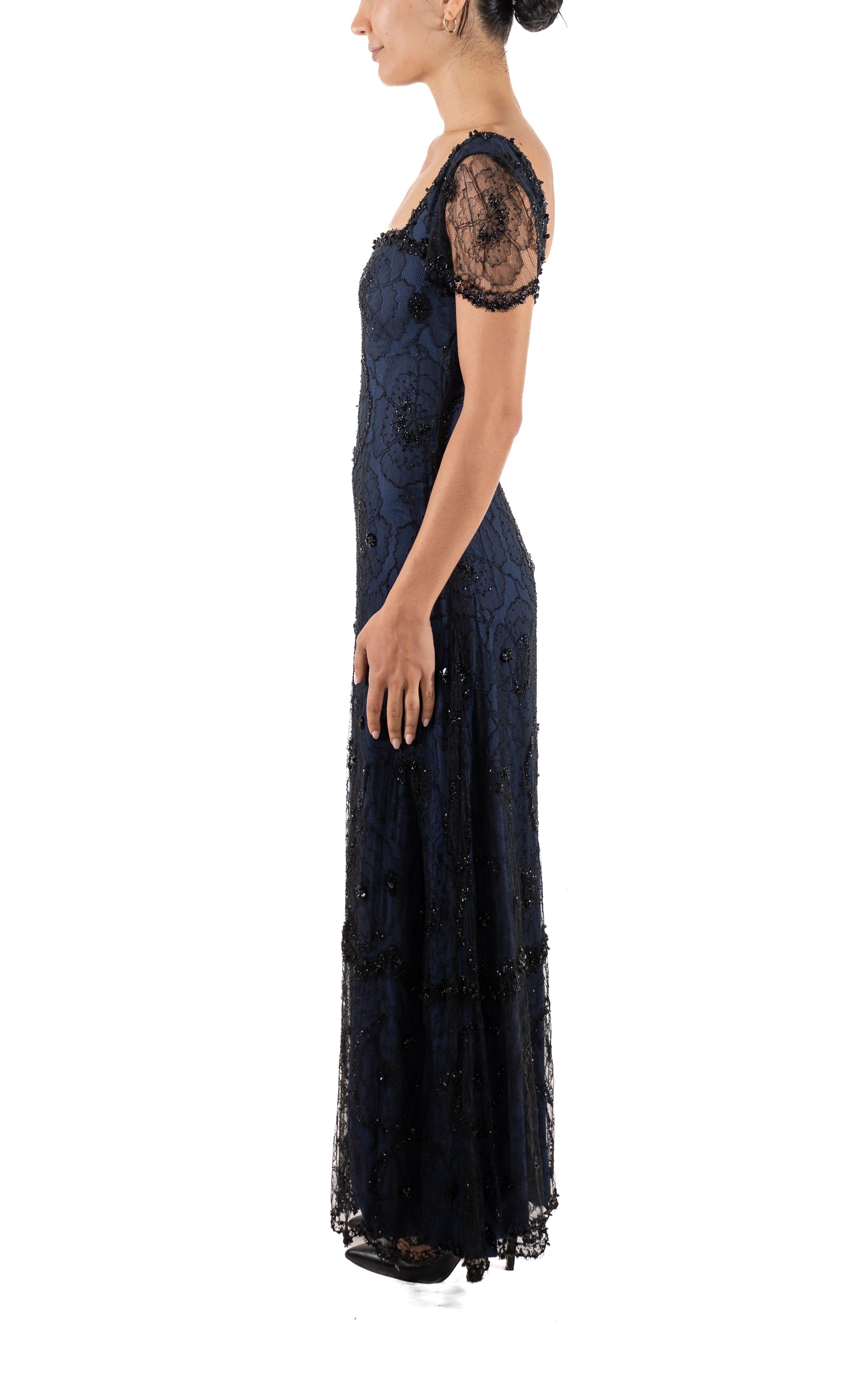 This gown retains no label, however the amount of hand-finishing points to Haute Couture or custom made quality, fully lined in silk. 1990S Black & Navy Rayon Silk Beaded Lace Titanic Inspired Gown 