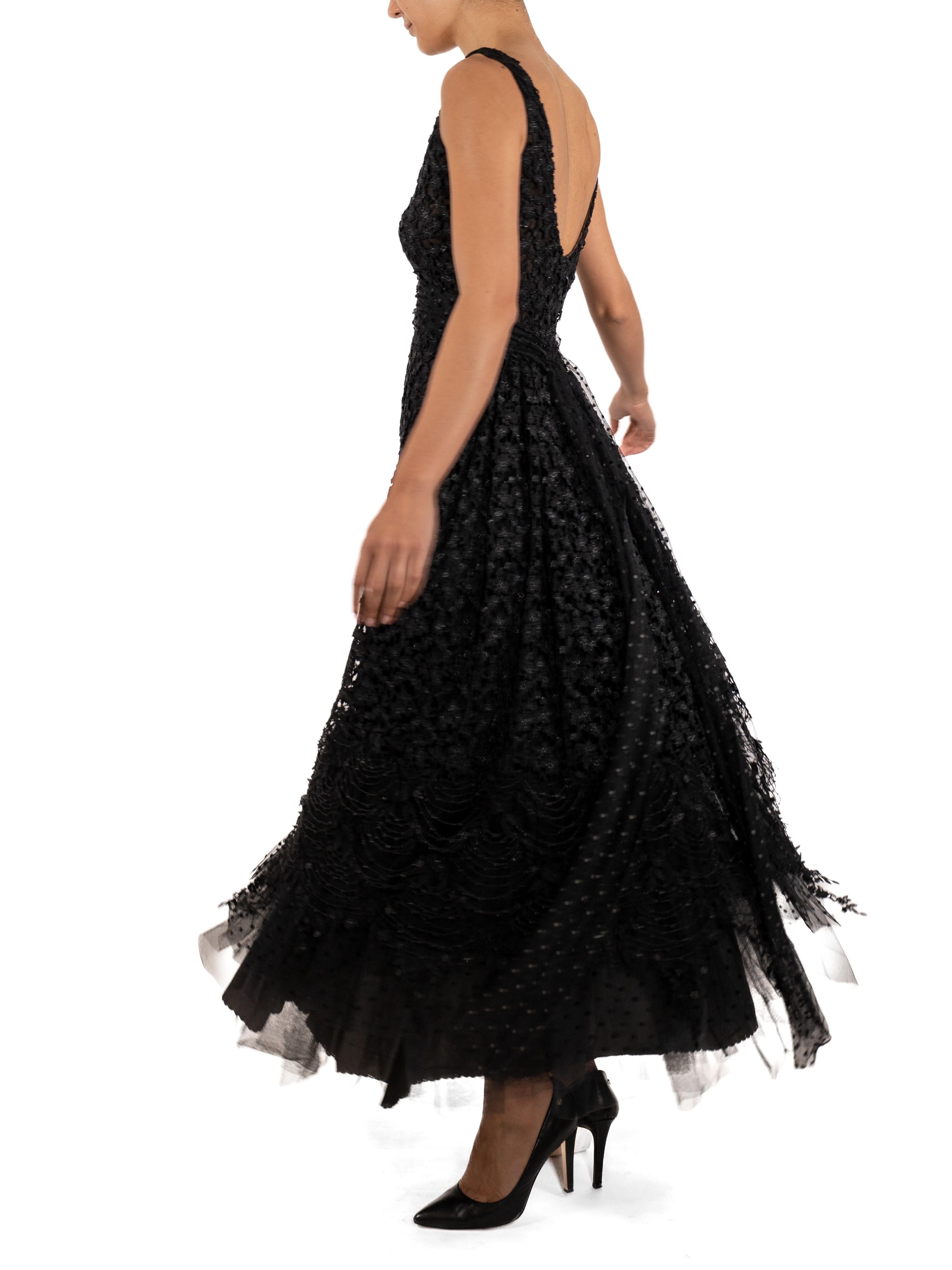 This gown retains no label, however the amount of hand-finishing points to Haute Couture or custom made quality, fully lined in silk. 1990S Black Poly/Nylon Lace & Layers Of Tulle Ball Gown 
