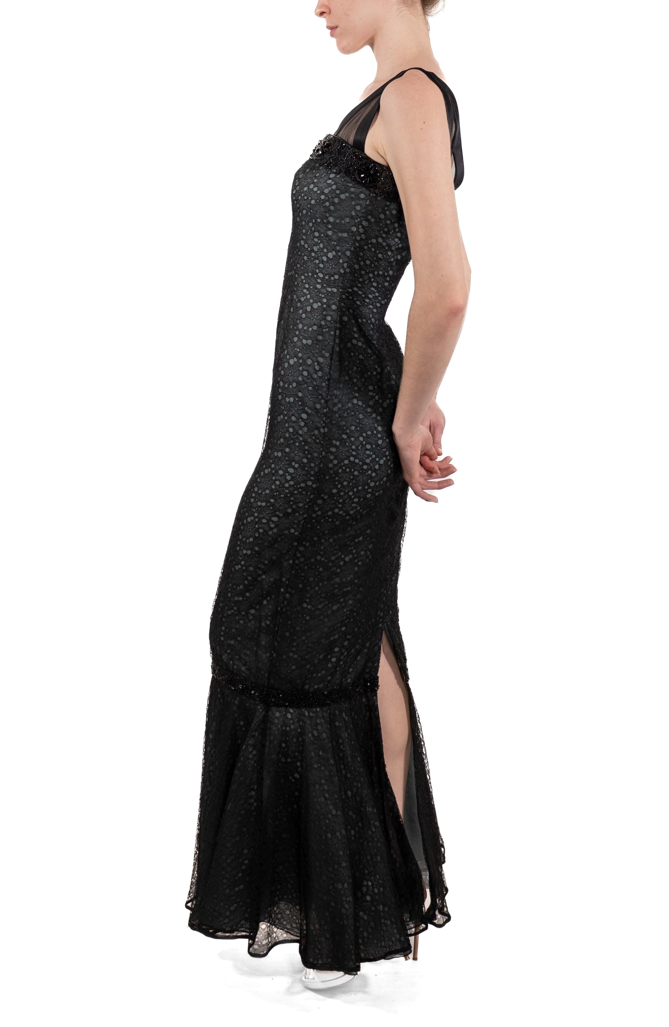 This gown retains no label, however the amount of hand-finishing points to Haute Couture or custom made quality, fully lined in silk. 1990S Black Rayon & Silk Lace Gown Underlined In Aqua Blue 