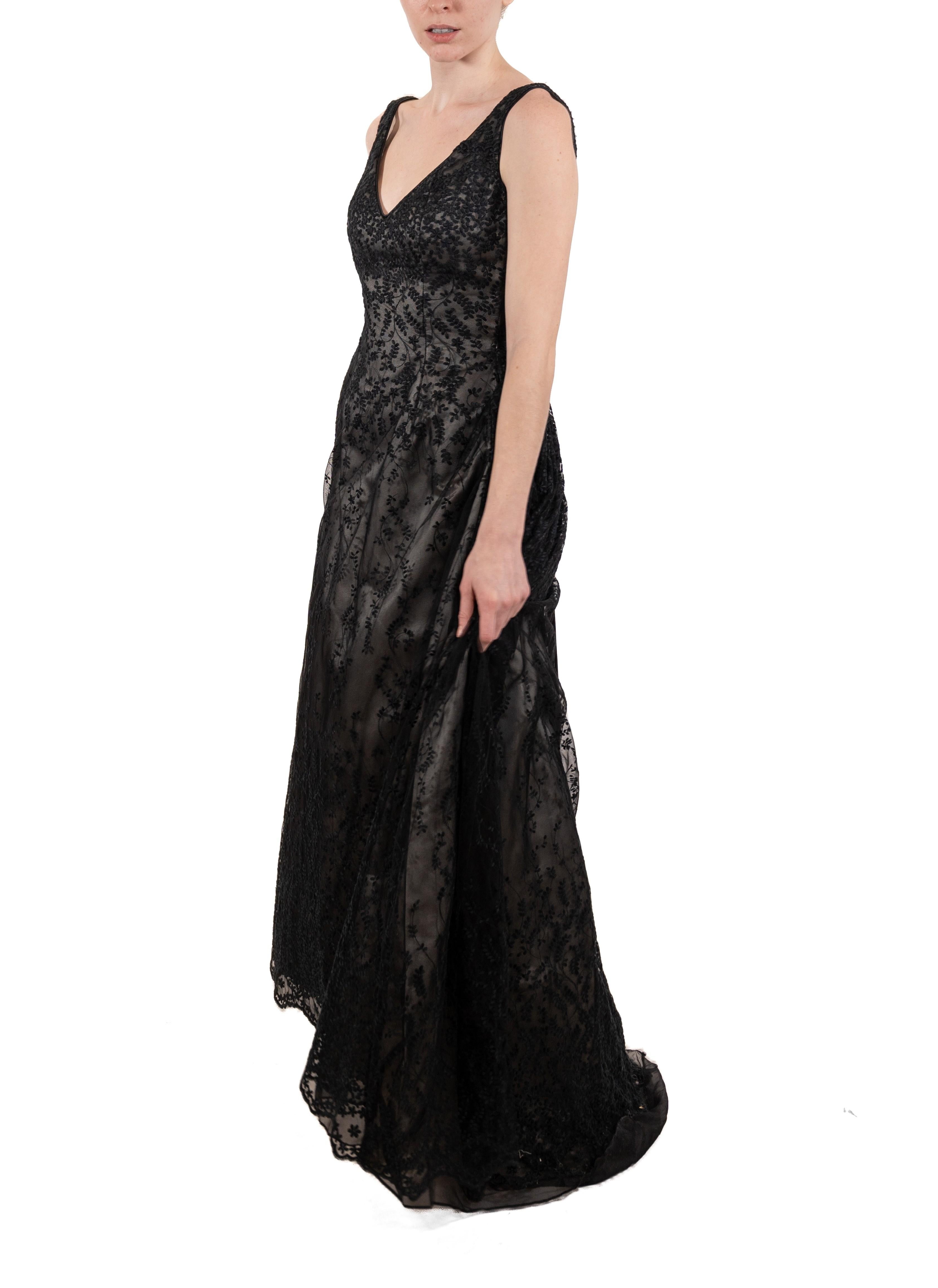 This gown retains no label, however the amount of hand-finishing points to Haute Couture or custom made quality, fully lined in silk. 1990S Black Semi-Sheer Embroidered Lace Ball Gown With Slight Train 