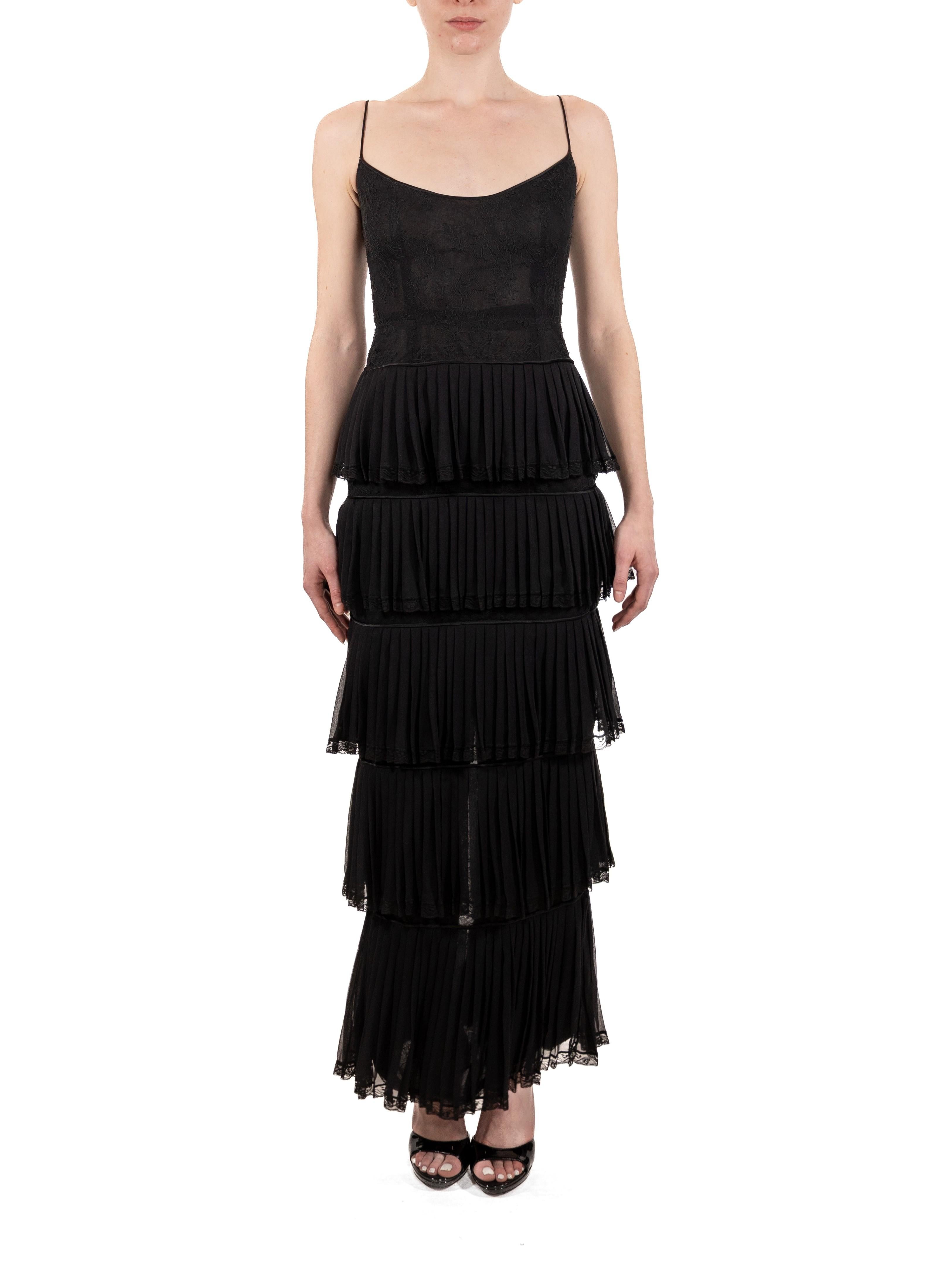 This gown retains no label, however the amount of hand-finishing points to Haute Couture or custom made quality, fully lined in silk. 1990S Black Silk Chiffon & Lace Gown With Ruffled Skirt 