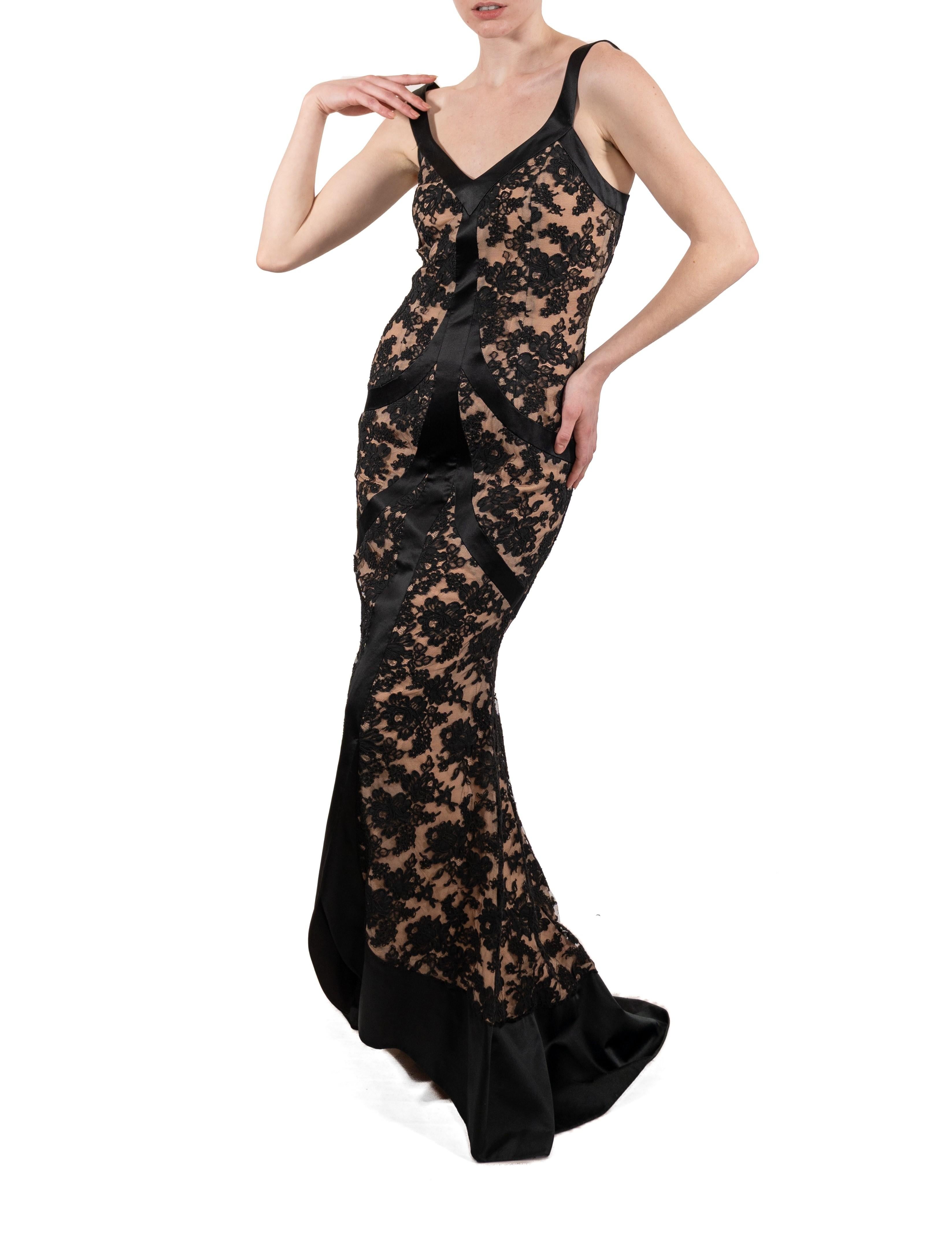 This gown retains no label, however the amount of hand-finishing points to Haute Couture or custom made quality, fully lined in silk. 1990S Black Silk & Rayon Satin Lace Gown With Train 