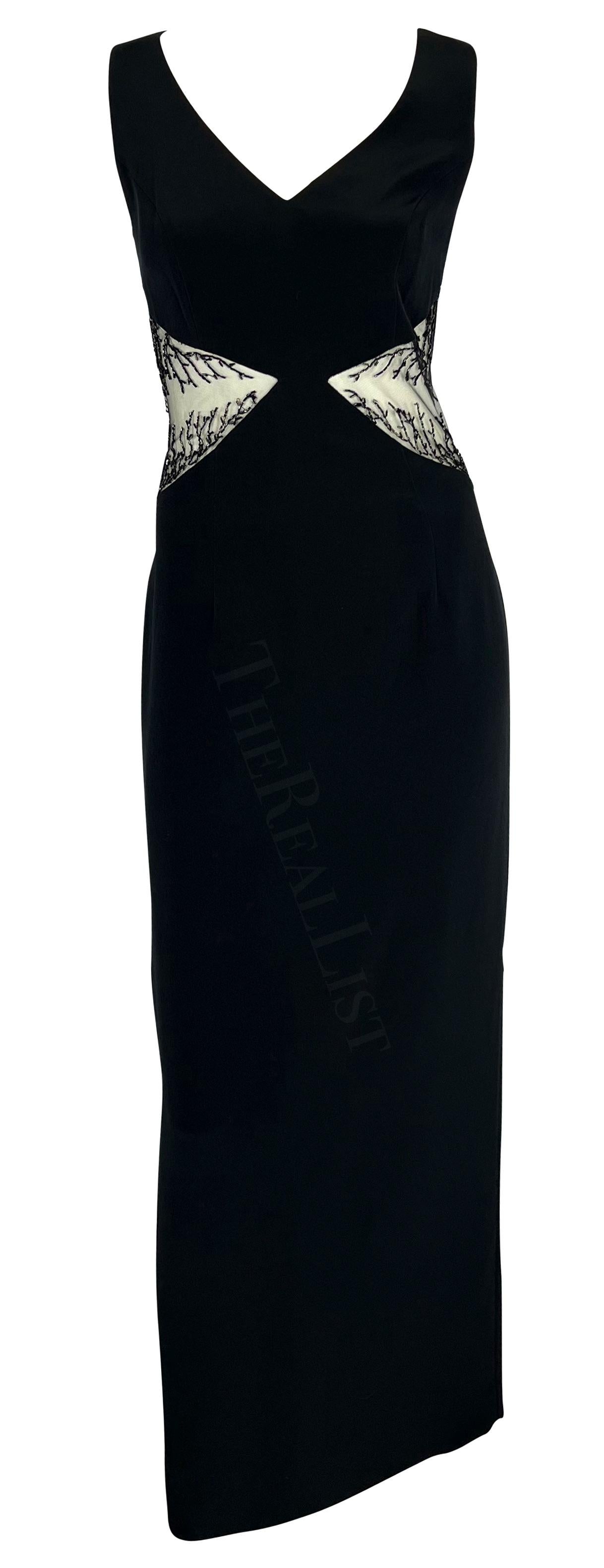 Presenting a chic black beaded Bob Mackie sleeveless gown. From the 1990s, this sexy floor-length dress features a v-neckline, column cut, and is made complete with sheer-covered cut-outs on either side of the waist. The cutouts are adorned with