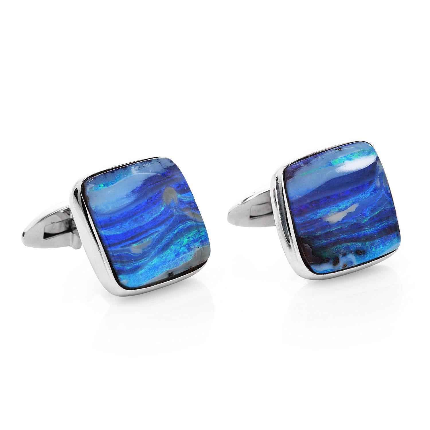 Bring the look of the sea to every occasion.

These blue opal cufflinks are crafted in solid platinum with 14K white gold backs.

They weigh 17.3 grams and measure 17 mm x 16 mm. Showcasing a pair of cabochon cushion square cut, blue opals, weighing