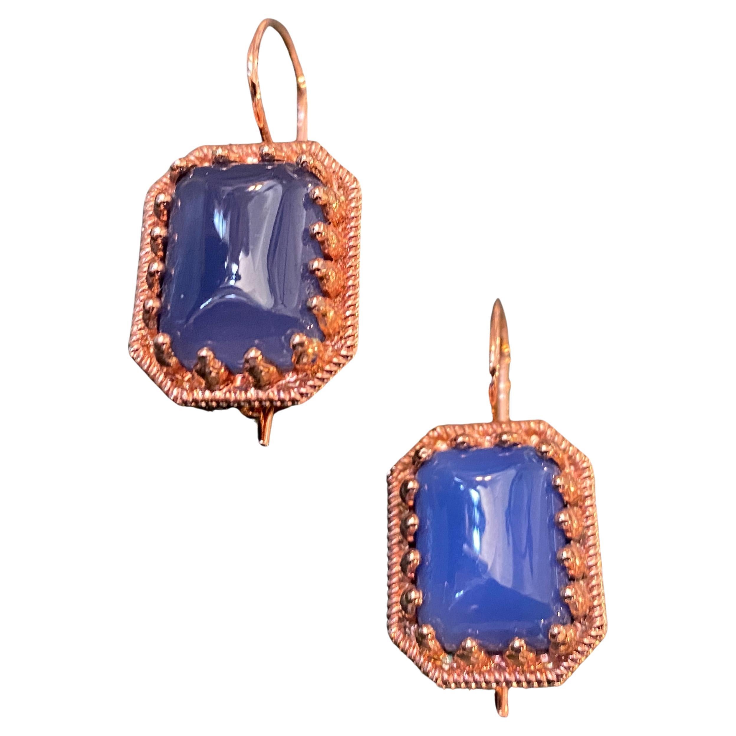 A bronze parure composed by a ring and a pair of earrings designed and manufactured in Italy by Anomis. The rectangular cabochon blue agate are in perfect condition.