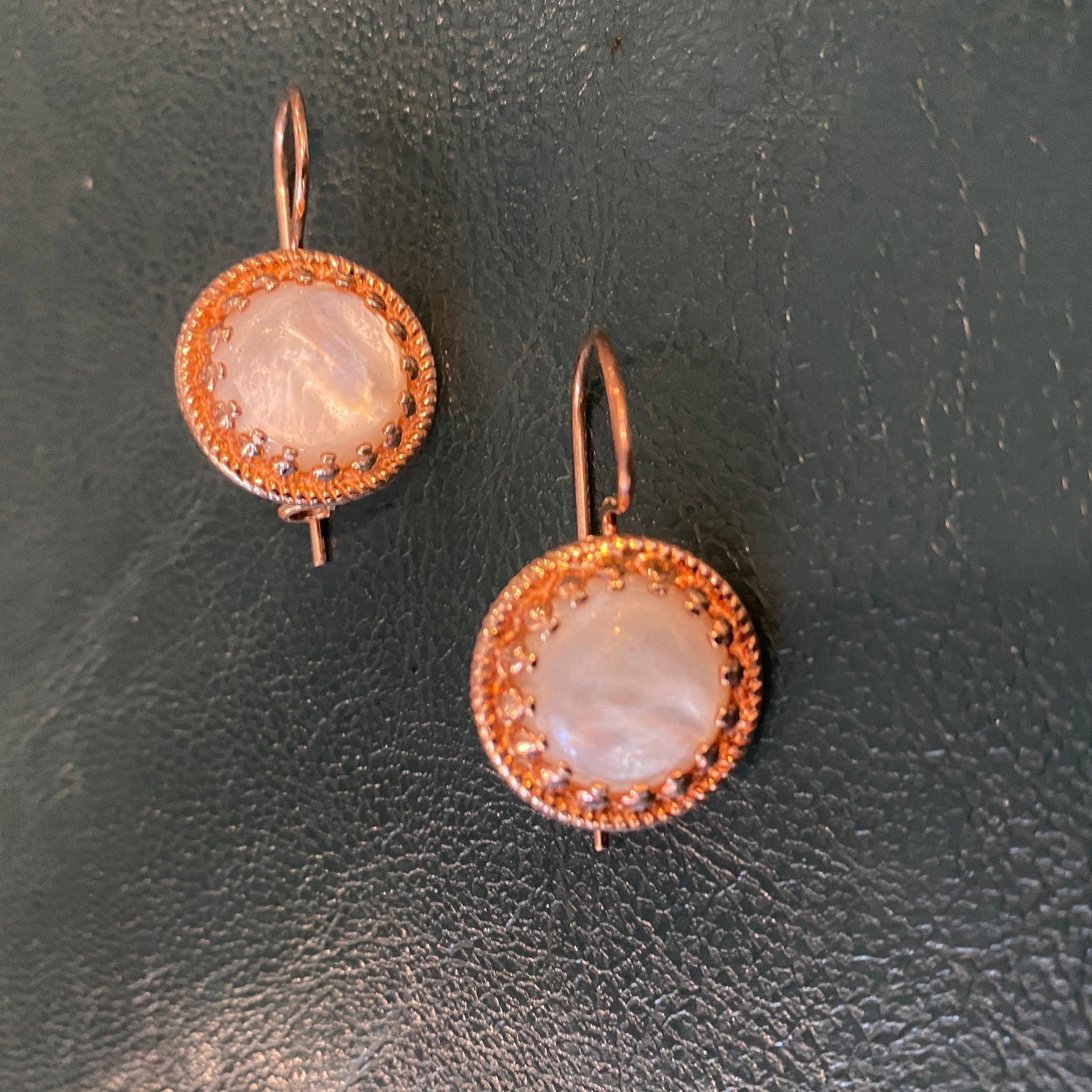 A never worn pair of hand-crafted bronze and round mother pearl pair of earrings designed and manufactured in Italy in the Nineties Anomis.