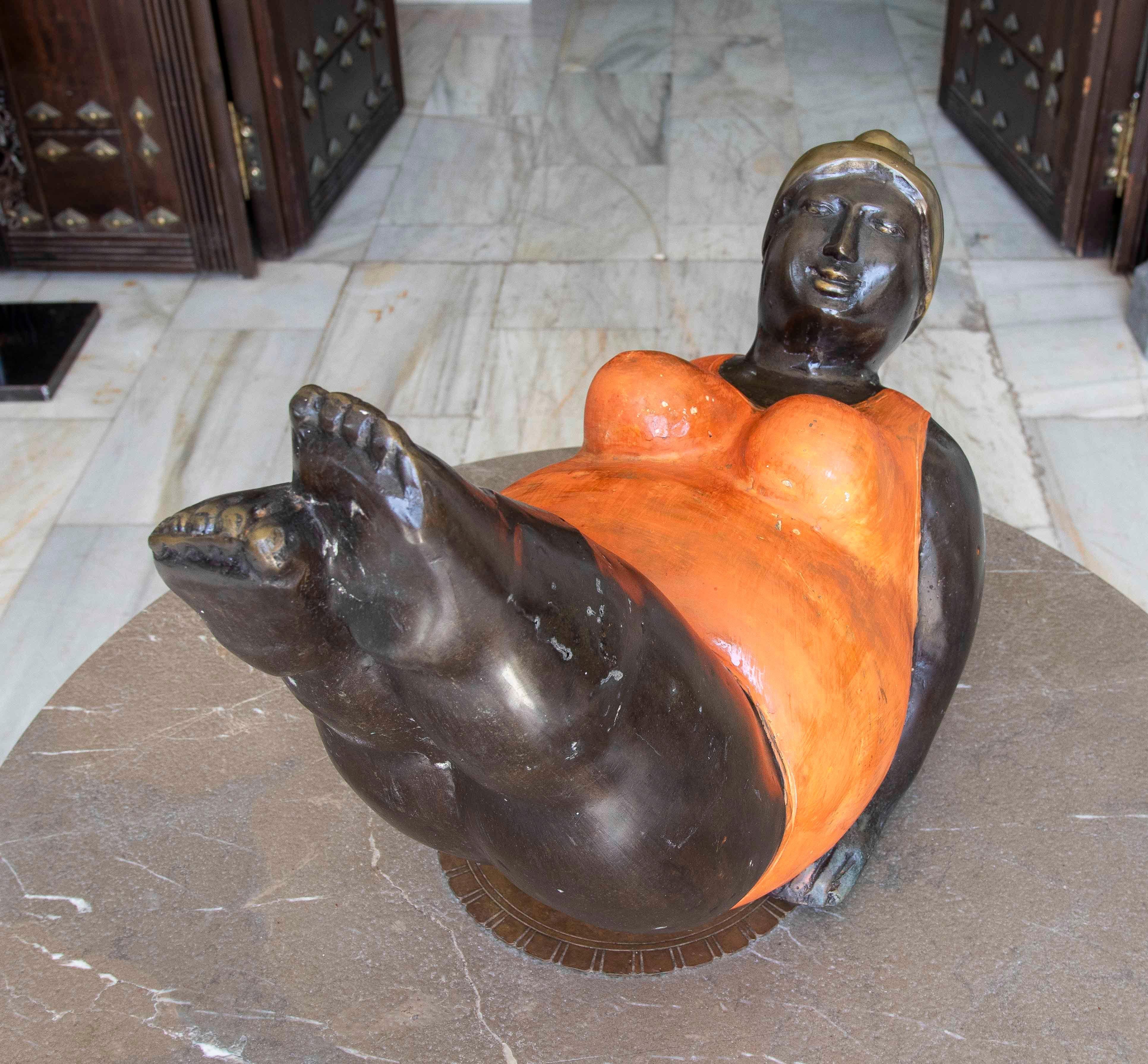 European 1990s Bronze Sculpture of a Reclining Woman in an Orange Swimsuit For Sale