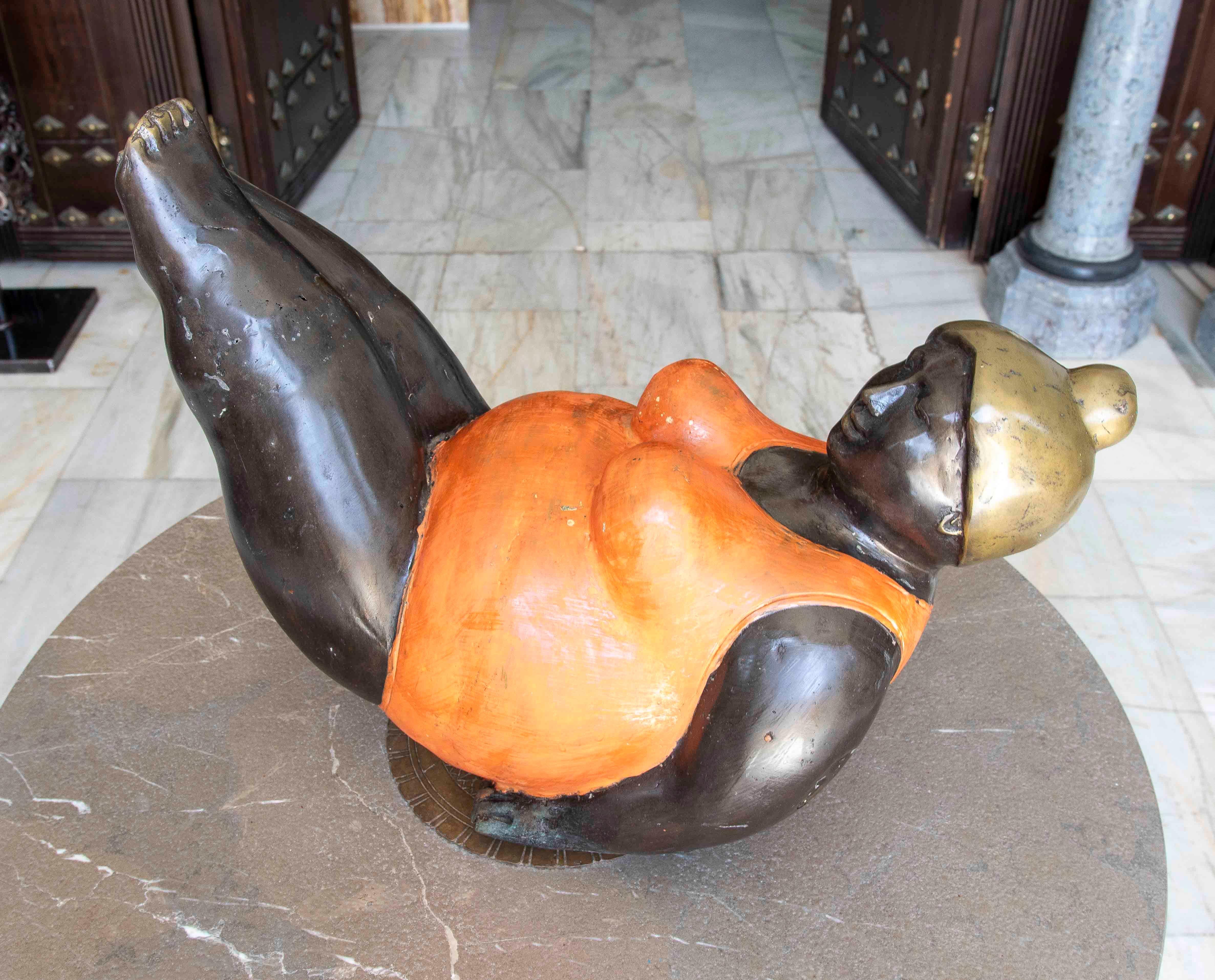 Hand-Painted 1990s Bronze Sculpture of a Reclining Woman in an Orange Swimsuit For Sale