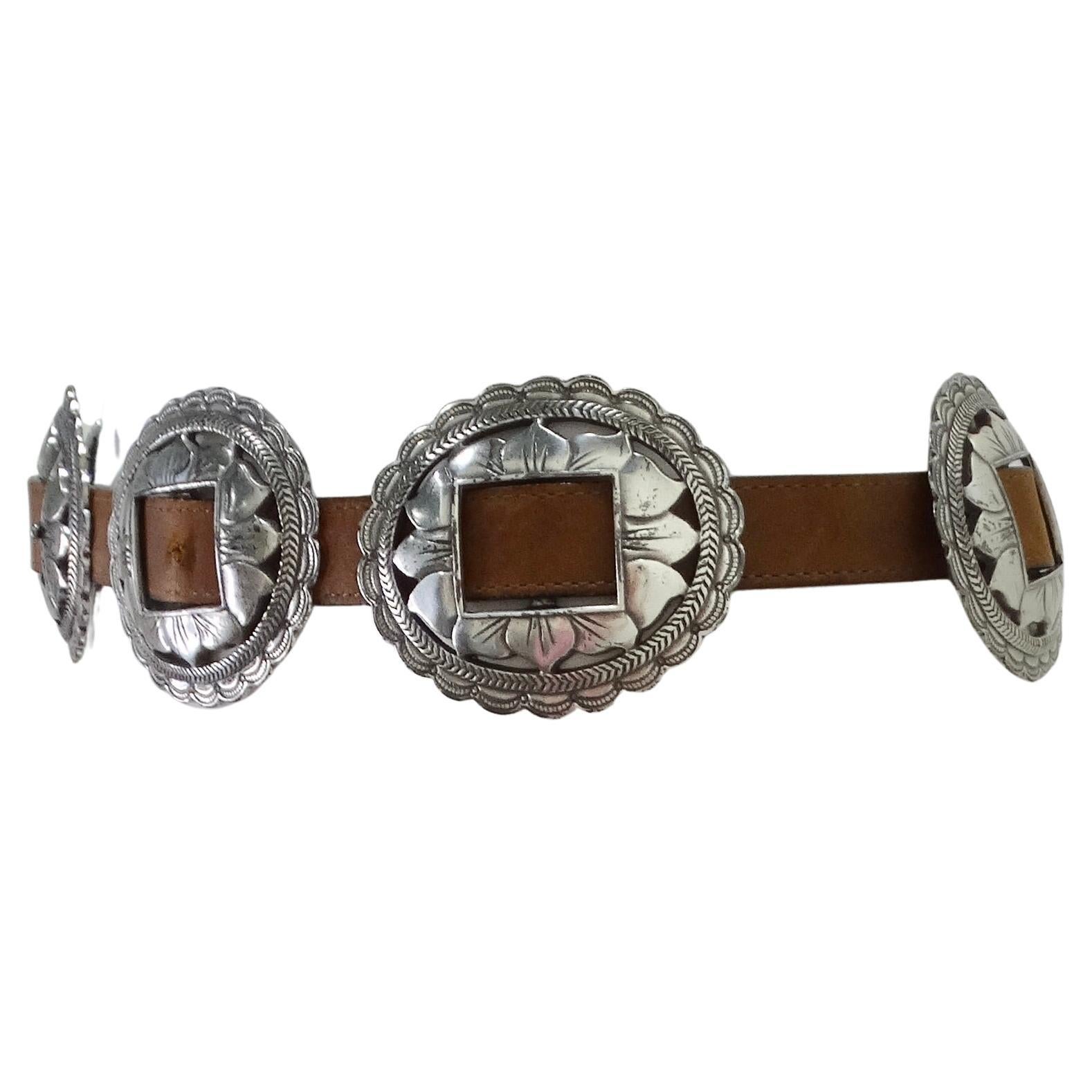 Elevate Your Style with the 1990s Brown Leather Belt! Step into the world of statement fashion with this exquisite 1990s Brown Leather Belt featuring silver-tone flower engraved buckles throughout. Crafted with meticulous attention to detail, this