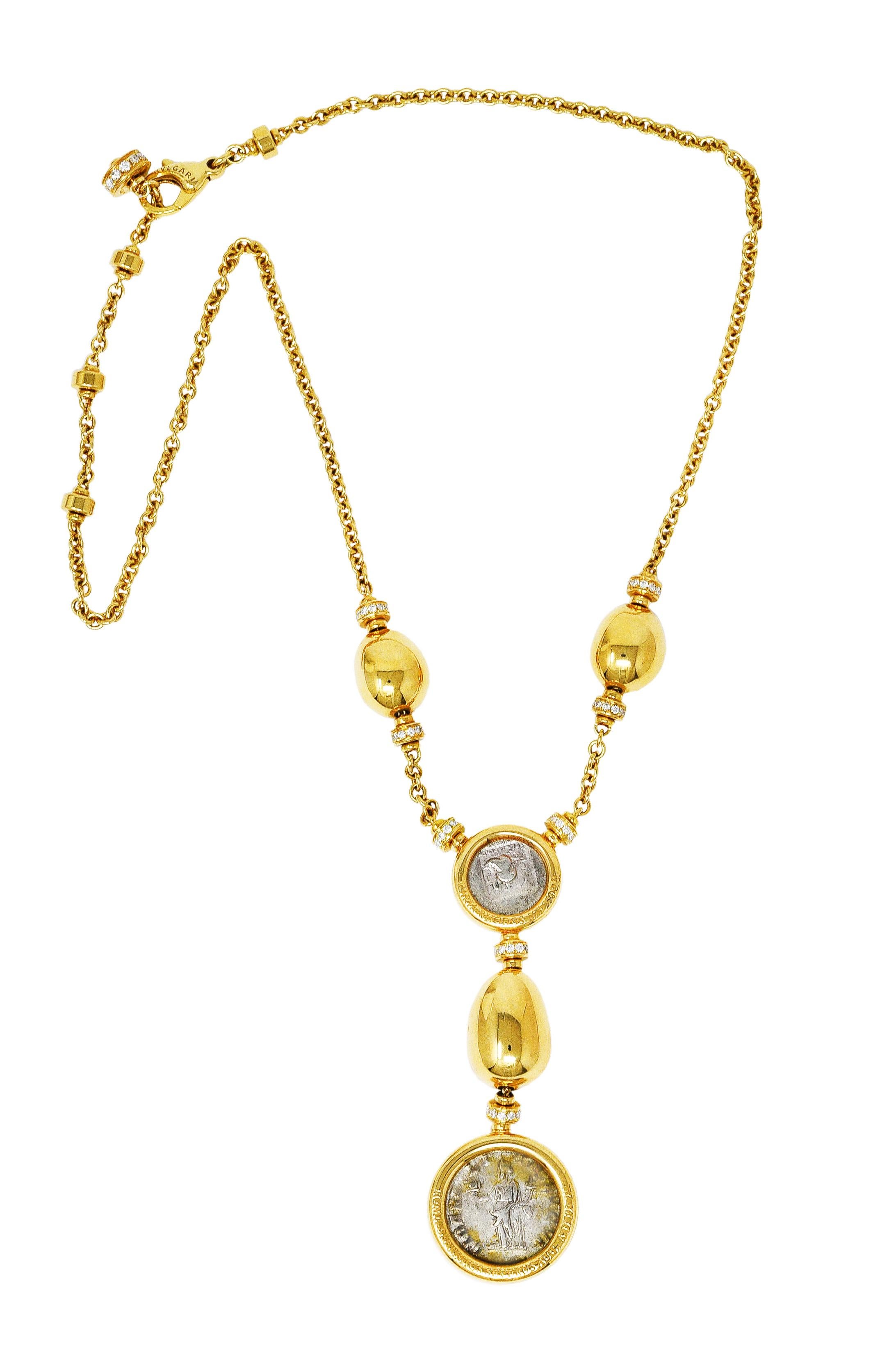 Cable chain necklace features intermittent gold rondelle stations and polished gold organic forms. Featuring two ancient coins bezel set in polished gold surrounds inscribed with their details. Surmount is a silver didrachm featuring Helios, the sun