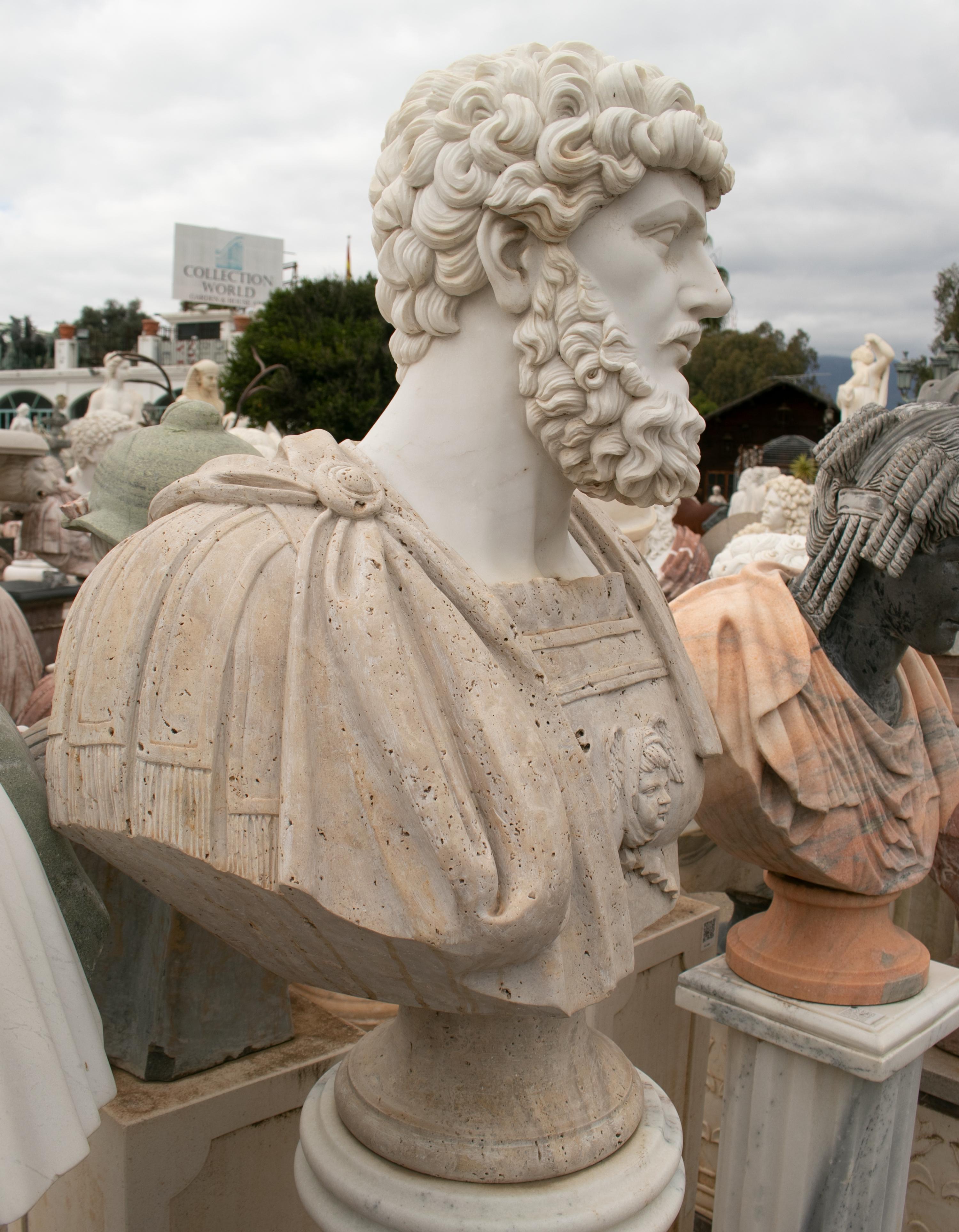 1990s Bust of a Roman, hand carved by craftsmen using Carrara white marble for the head and travertine marble on the toga, where the white veins give movement and realism to the cloth.