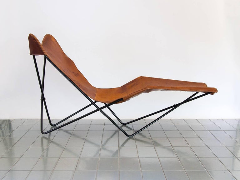 1990's Aregntinian chaise lounge, design based on the classic BKF Butterfly chair. This piece has an amazing silhouette and is extremely comfortable. Leather shows beautiful passage of time, and iron structure is in great conditions. Big dimensions
