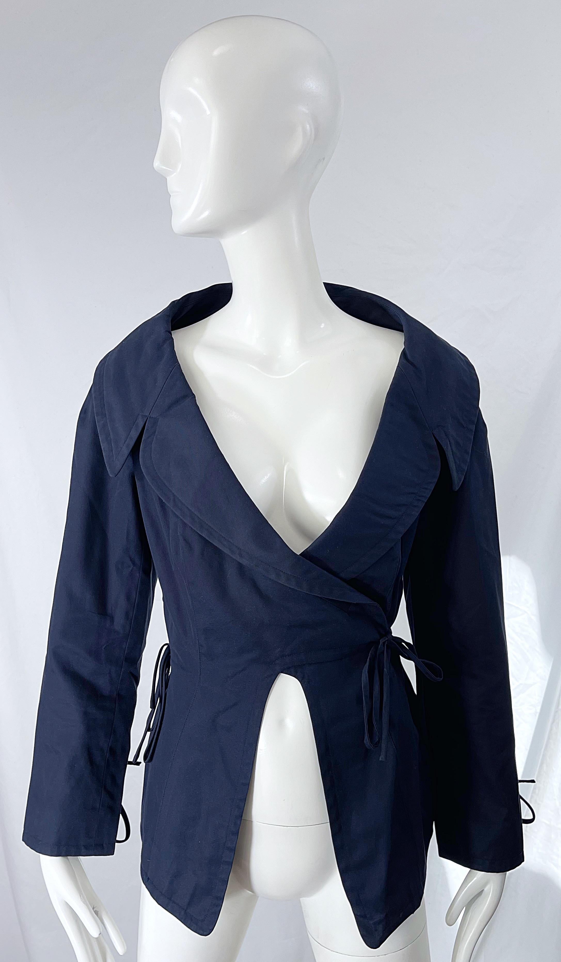From one of my favorite 90s designers; BYRON LARS ! Chic navy blue cotton wrap jacket ! Features ties at each sleeve cuff, and sides. Can easily be dressed up or down, worn alone or layered. 
In great condition 
Made in USA
Approximately Size