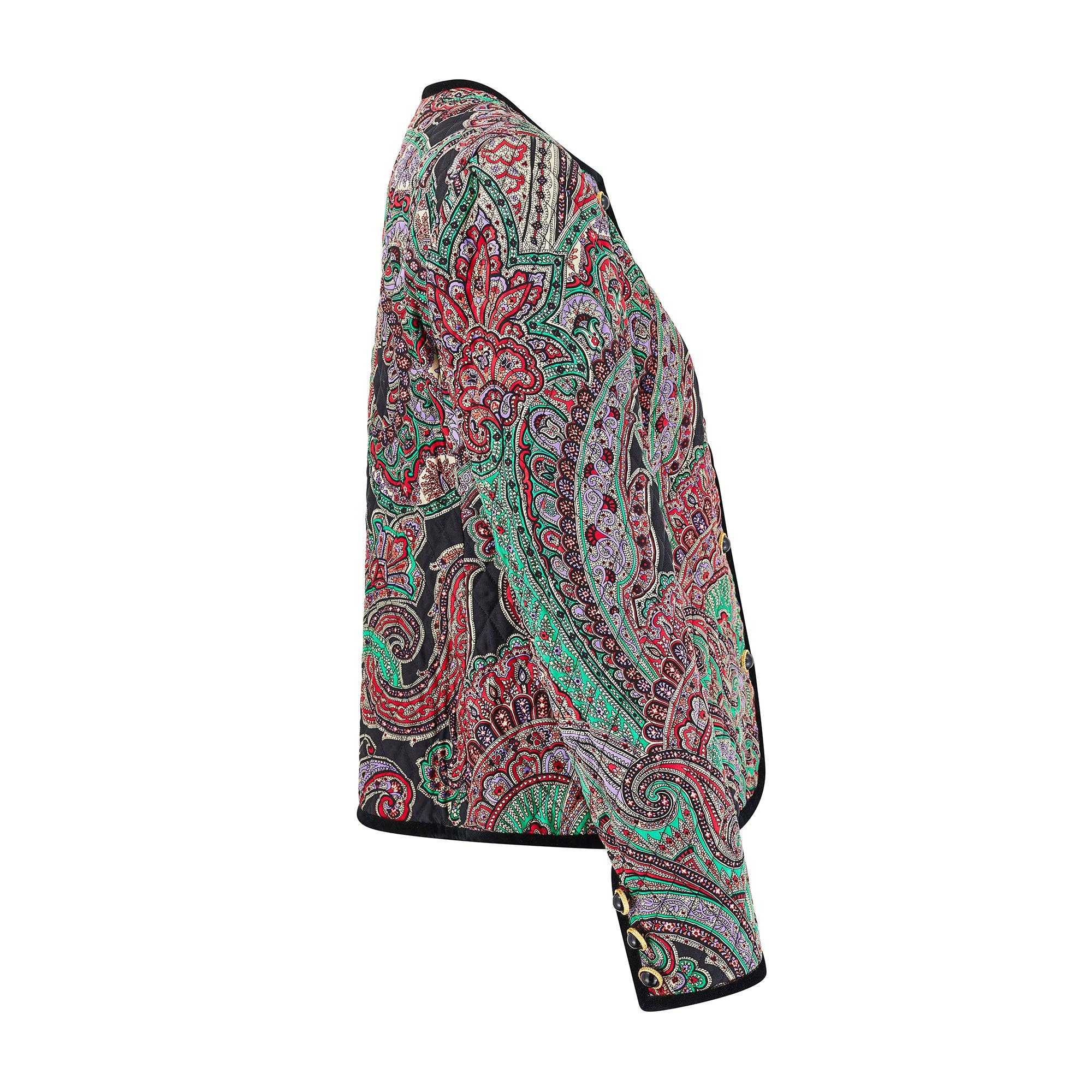 This vibrant 1990s vintage jacket by Carlisle is crafted from printed silk finished with black threaded quilting all-over.  Superbly made, the print is an intricate paisley drawn in black outlines with emerald green, lilac, red, coral and palest