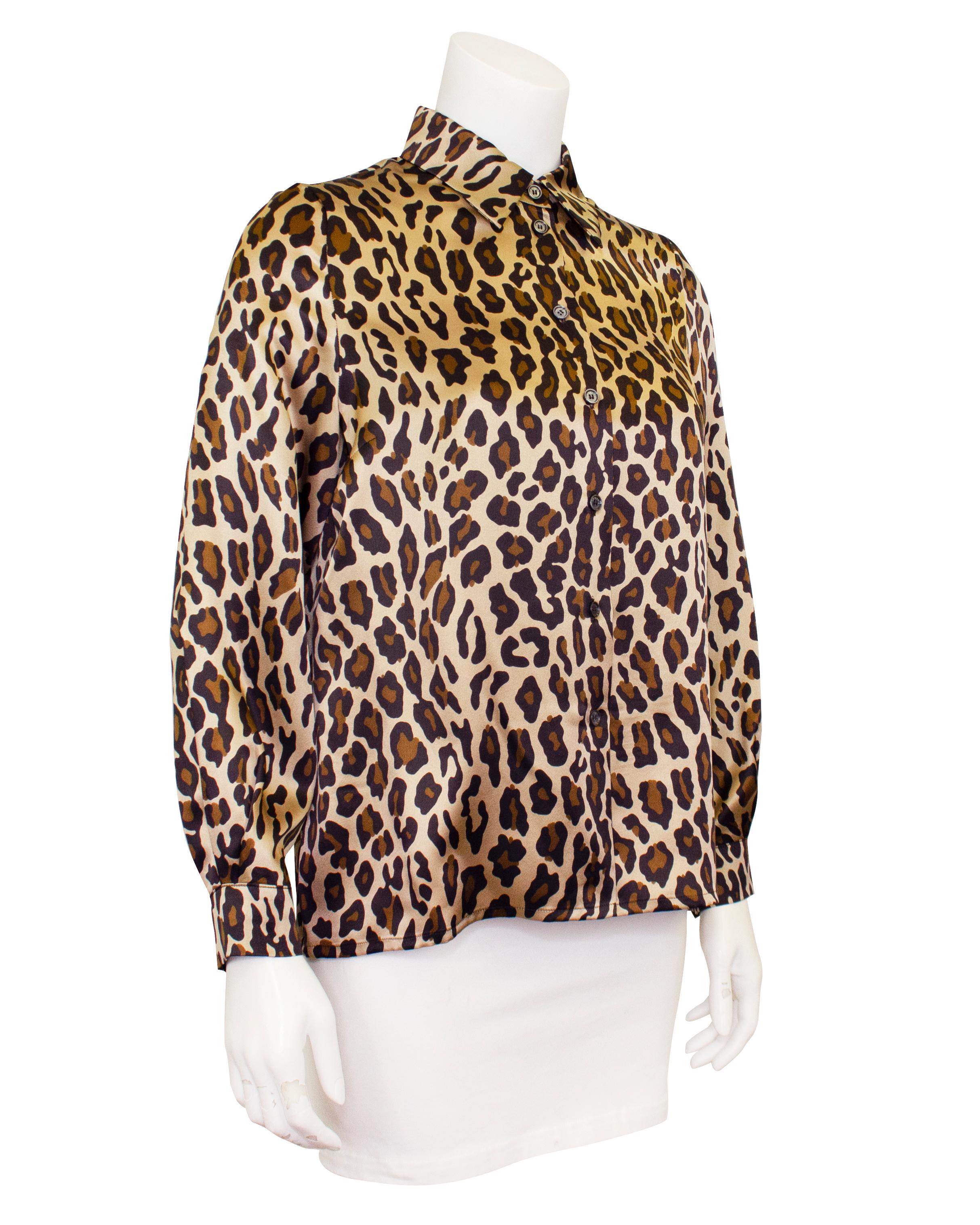 This 1990s Celine silk leopard print shirt is such a great piece. Classic button up blouse shape with cuffed sleeves and slightly loose straight cut throughout  the body. Leopard is a neutral print and this shirt can be worn in so many ways.
