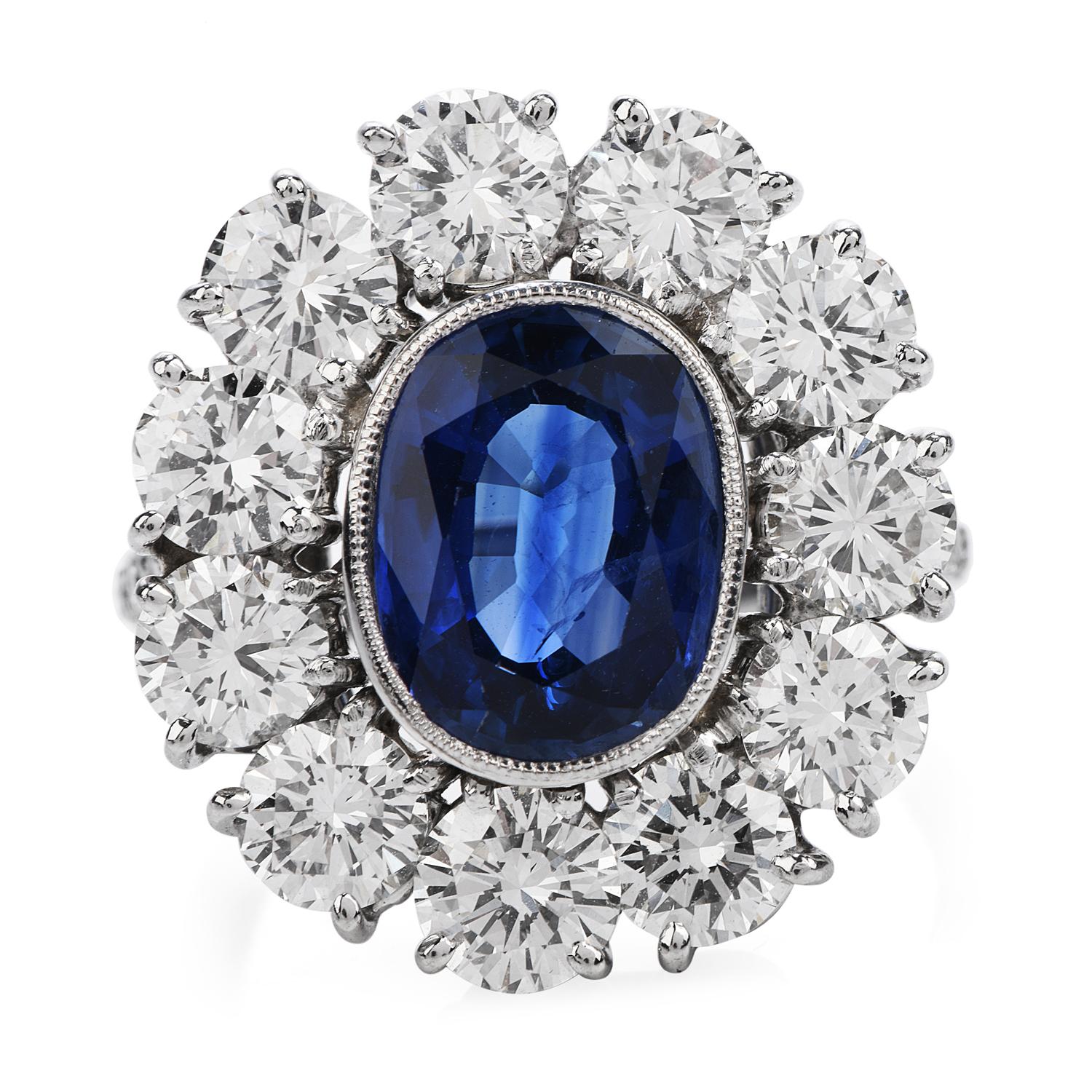 Shining from every angle, it is crafted in solid Platinum with an  Oval Cut And Bezel set,

GRS Certified Heated  Sri Lankan Ceylon Sapphire in the center weighing 4.10 carats,

surrounded by a Halo of Flower Petals, with Excellent Cut Round