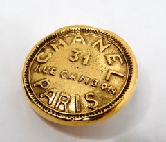 1990s Chanel 31 Rue Cambon Gold Tone Medallion Singular Clip-On Earring