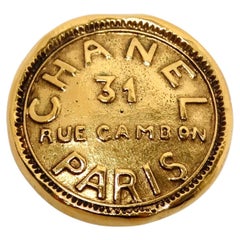 1990s Chanel 31 Rue Cambon Gold Tone Medallion Singular Clip-On Earring