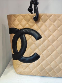 1990s Chanel beige and black cambon lamb skin tote bag