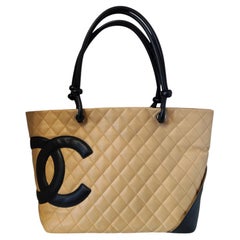 1990s Chanel beige and black cambon lamb skin tote bag