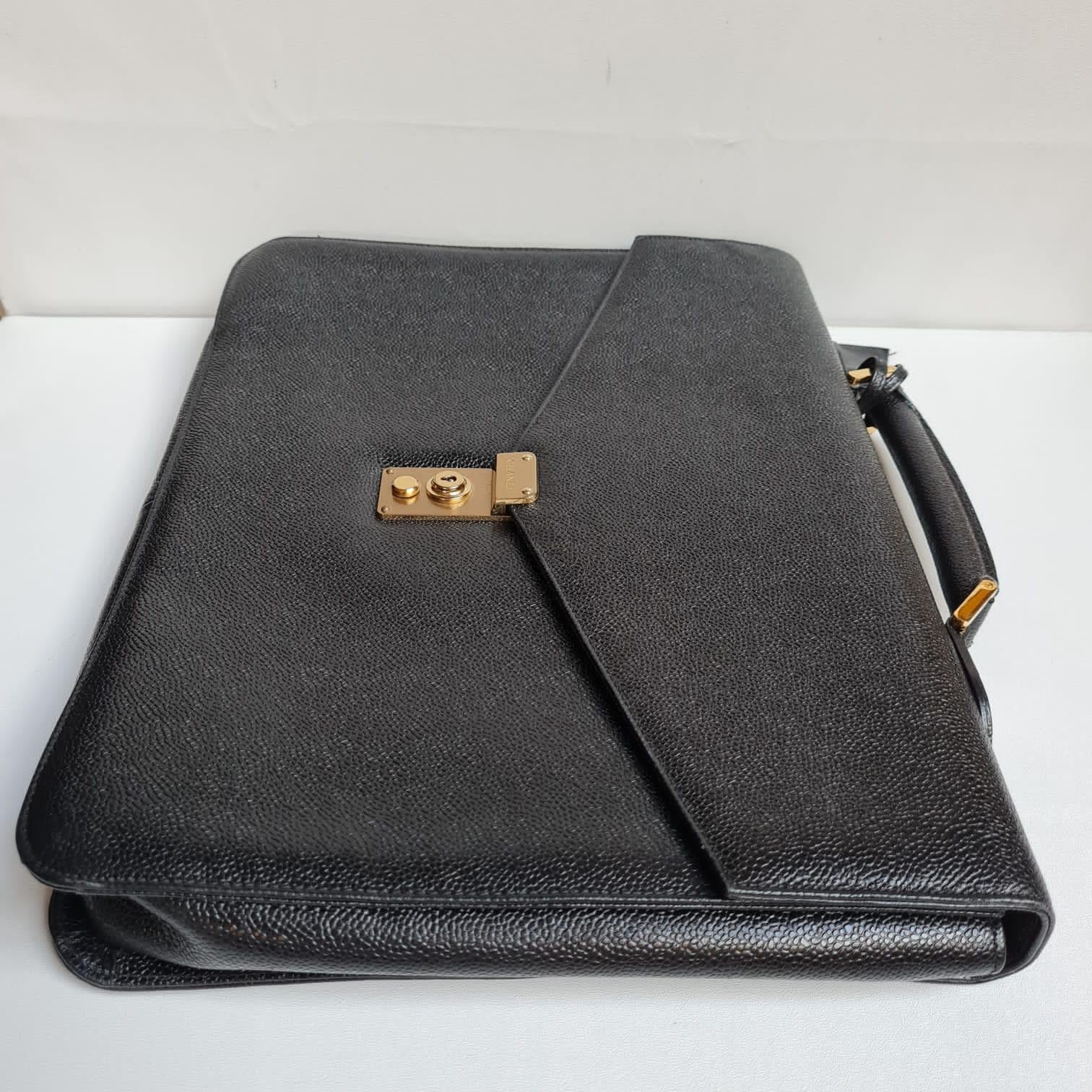 Vintage 90s caviar top handle briefcase. Item is still in great condition. Item #3. Item comes as it is with the clochette attached.