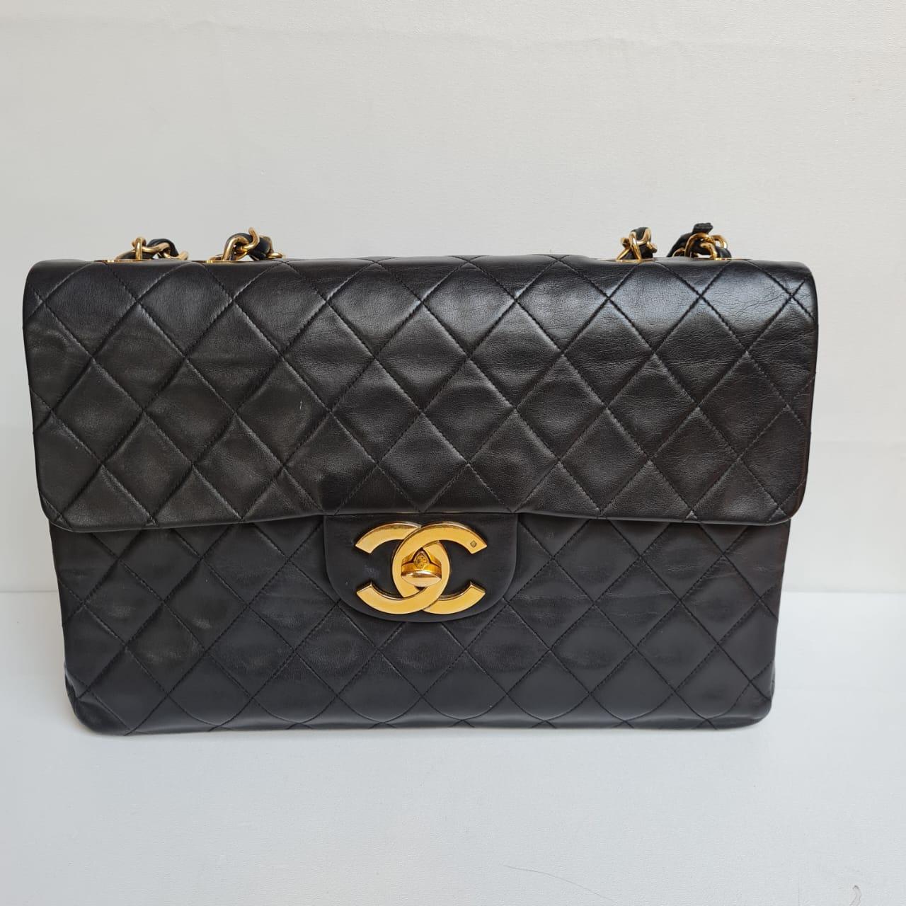 Women's or Men's 1990s Chanel Black Lambskin Leather Maxi Flap Bag