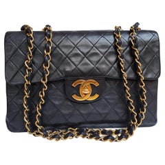 Retro 1990s Chanel Black Lambskin Leather Maxi Flap Bag