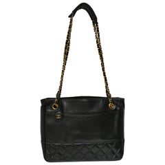 1990s Chanel black leather gold hardware shoulder bag