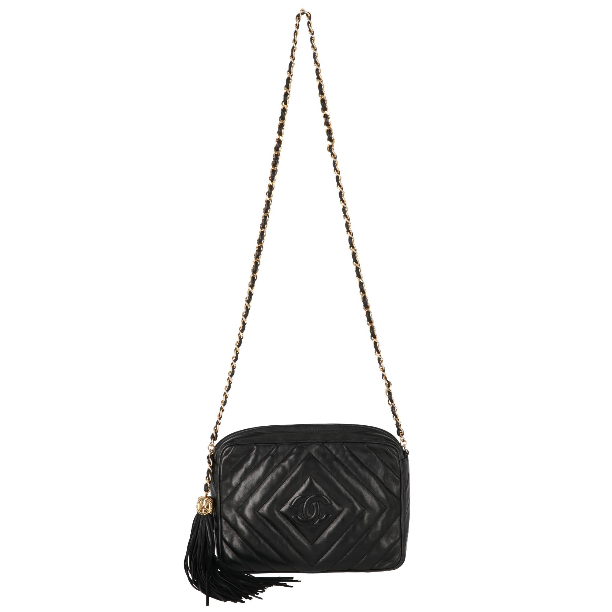 Chanel original black soft lamb leather shoulder bag with gold-tone chain and interlaced brown leather shoulder bag, matelassé with front quilted logo, one inner zipped pocket, decorative tassel pendant with gold tone metal logo detail and black