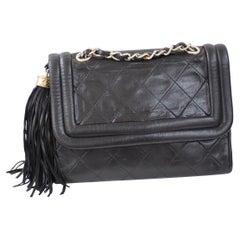 1990s Chanel black leather shoulder bag