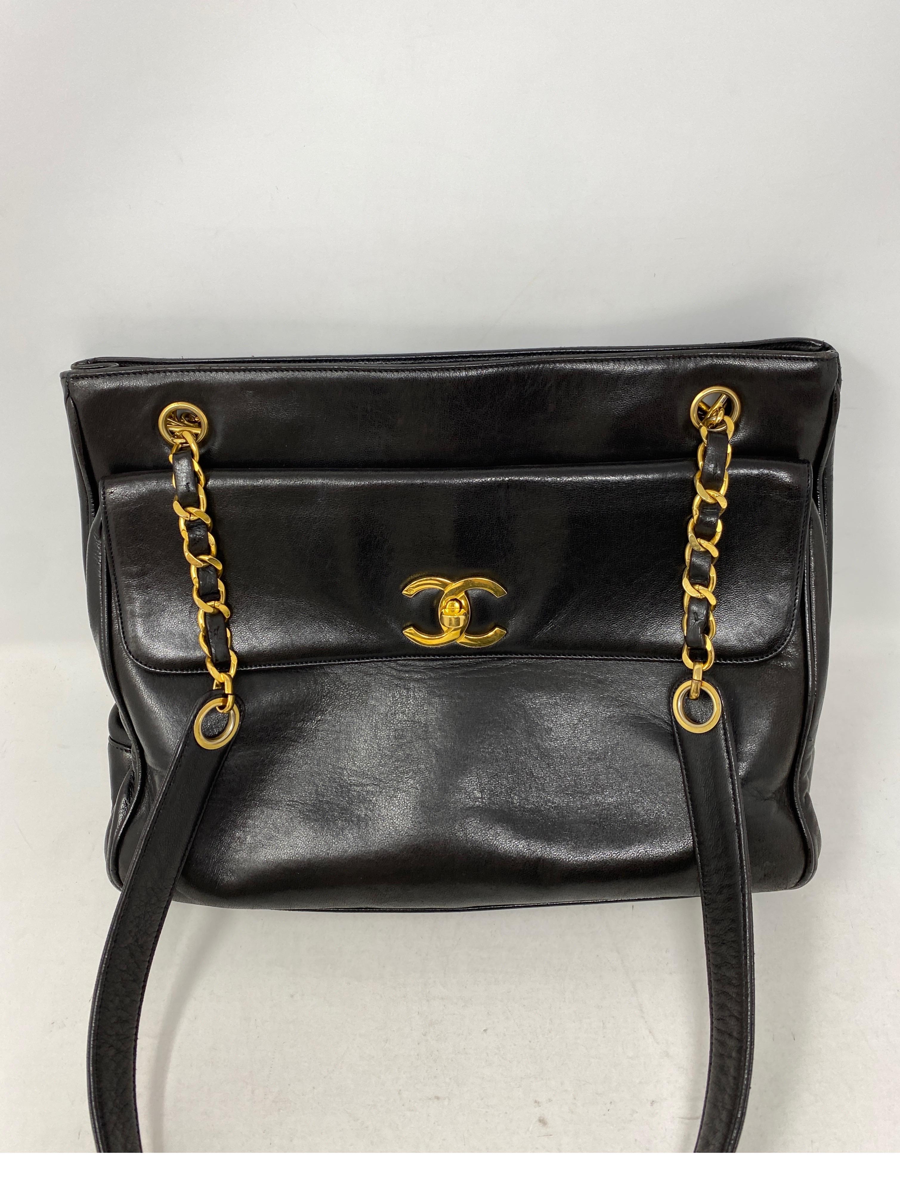 Chanel Vintage Black Leather Tote Bag. Soft lambskin leather bag with gold hardware. Good condition. 24 kt gold plating on hardware. From the 90's. Beautiful bag. Nice longer straps. Offered at a great price. Highly collectible vintage bag.