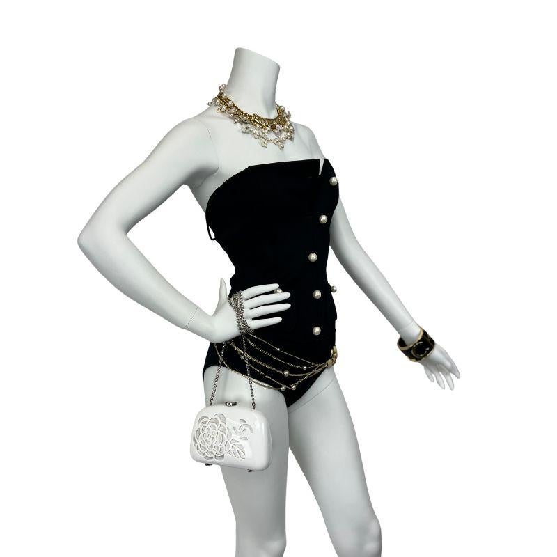 Effortlessly chic and iconically Chanel, this rare 1990s one-piece swimsuit channels the Maison’s timeless sophistication. Crafted from a luxe rayon-polyester blend, the sleek black silhouette hugs the body for a flattering, sculpted fit.

Elegant