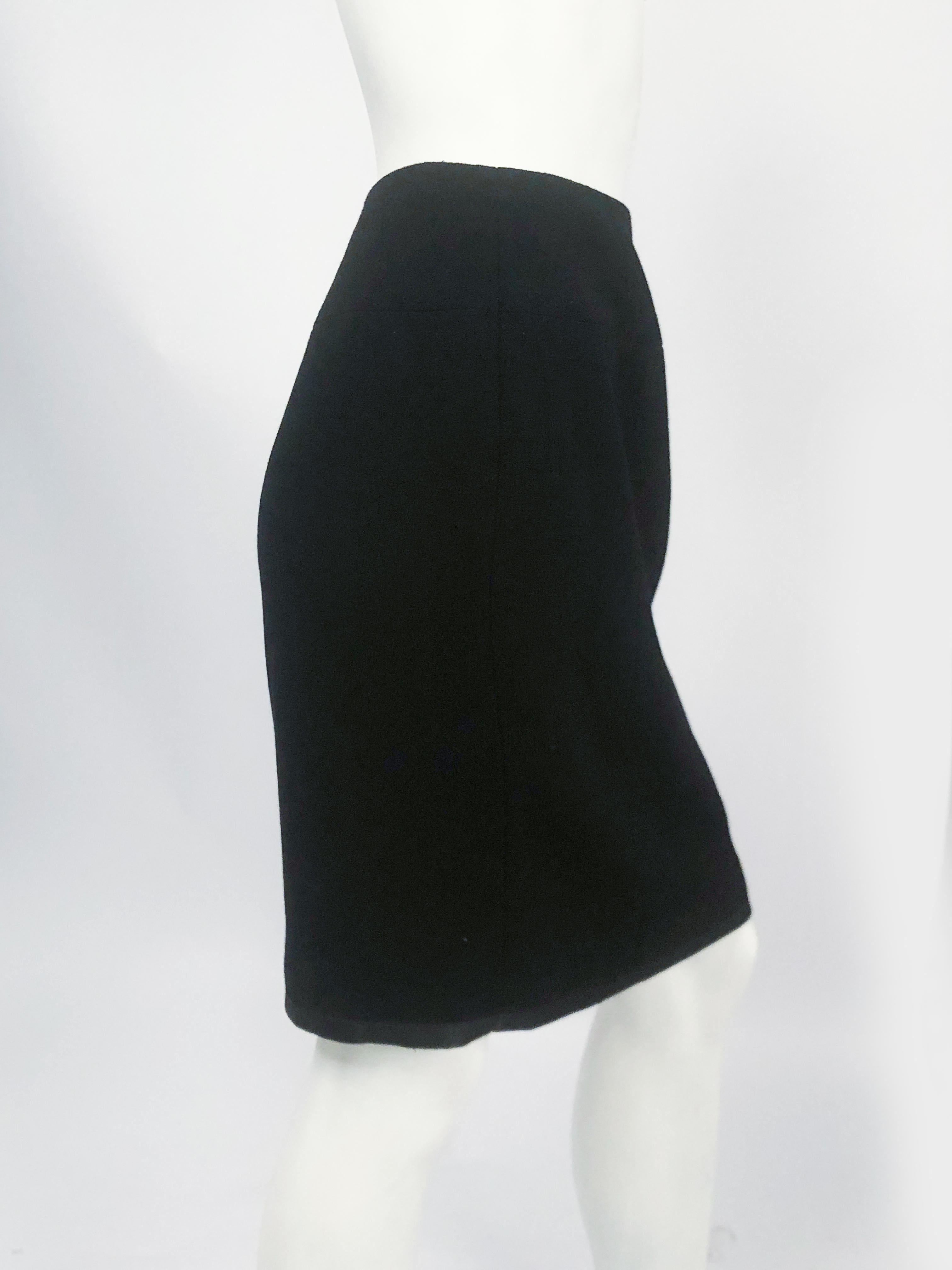 Women's 1990s Chanel Black Wool Skirt with Satin Hem and Silk Lining For Sale